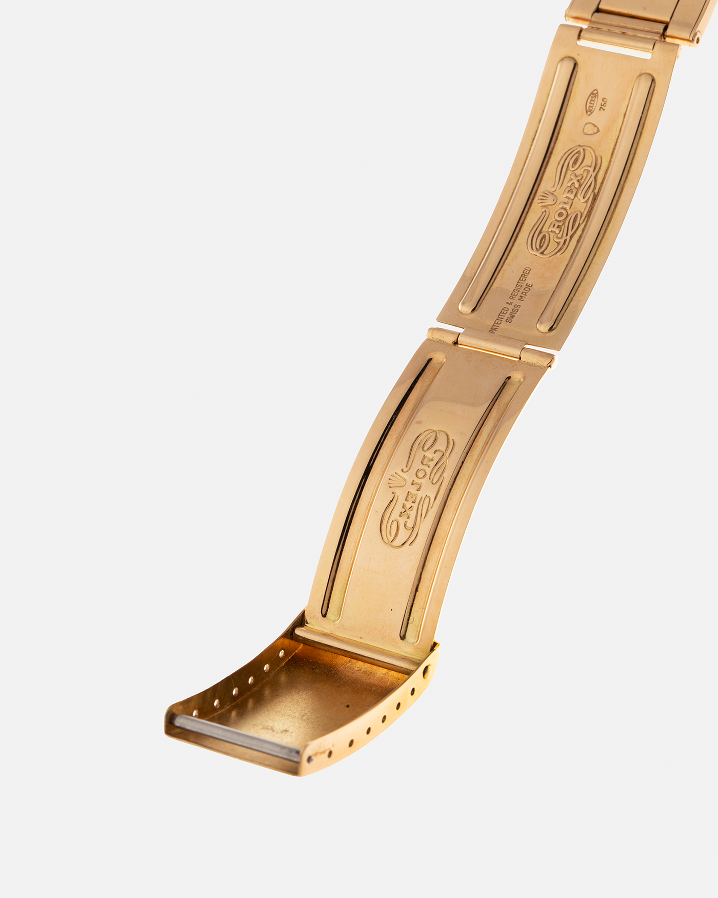 Brand: Rolex
Year: 1971
Model: Day-Date ‘Wide Boy'
Reference Number: 1803
Serial Number: 285XXXX
Material: 18-carat Yellow Gold
Movement: Rolex Cal. 1556, Self-Winding
Case Dimensions: 36mm x 12.5mm (Lug-to-Lug 43mm)
Lug Width: 20mm
Bracelet: Rolex Gay Frères Oyster Rivet Bracelet in 18-carat Yellow Gold with ‘76’ Endlinks and Signed Clasp