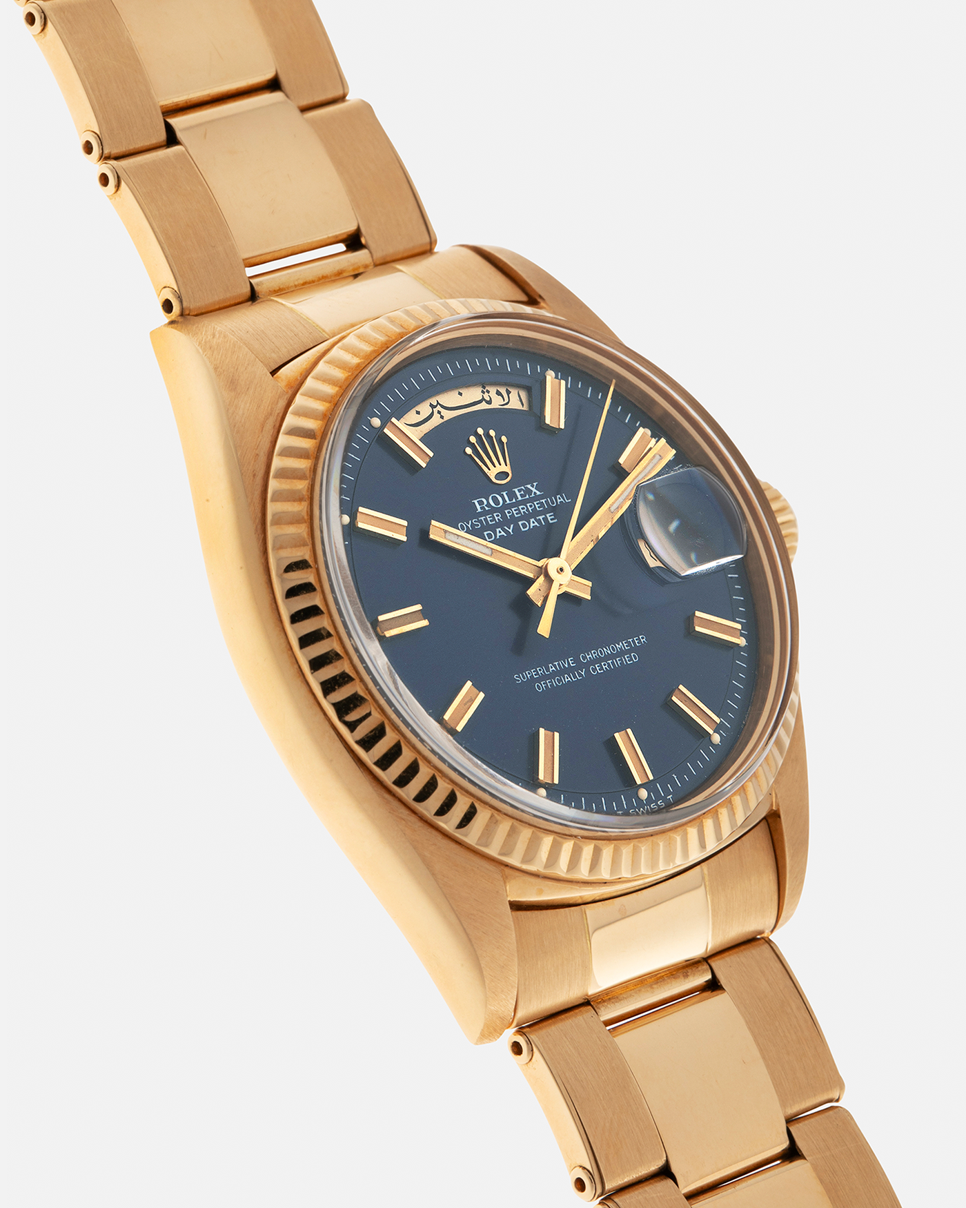 Brand: Rolex
Year: 1971
Model: Day-Date ‘Wide Boy'
Reference Number: 1803
Serial Number: 285XXXX
Material: 18-carat Yellow Gold
Movement: Rolex Cal. 1556, Self-Winding
Case Dimensions: 36mm x 12.5mm (Lug-to-Lug 43mm)
Lug Width: 20mm
Bracelet: Rolex Gay Frères Oyster Rivet Bracelet in 18-carat Yellow Gold with ‘76’ Endlinks and Signed Clasp