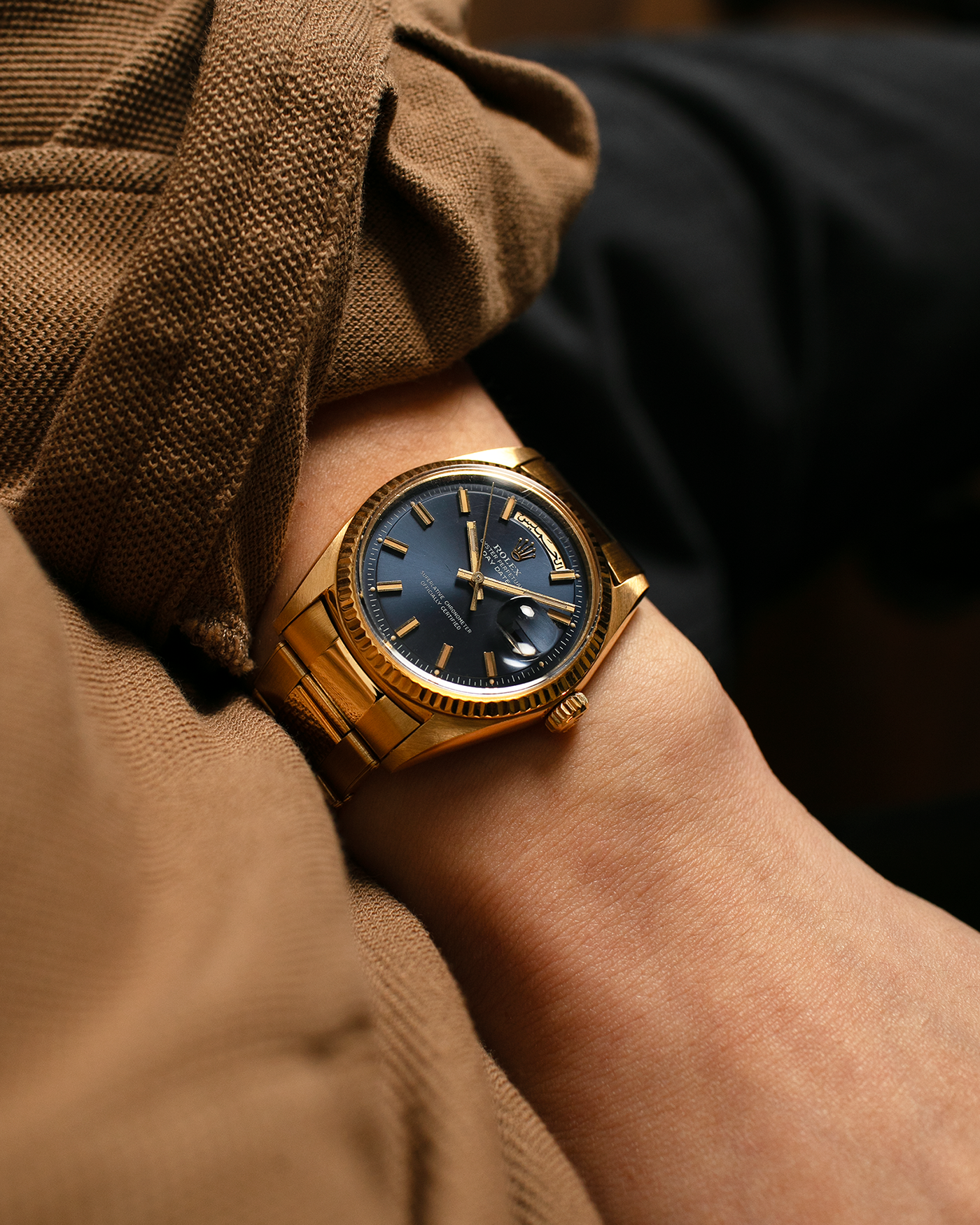 Brand: Rolex
Year: 1971
Model: Day-Date ‘Wide Boy'
Reference Number: 1803
Serial Number: 285XXXX
Material: 18-carat Yellow Gold
Movement: Rolex Cal. 1556, Self-Winding
Case Dimensions: 36mm x 12.5mm (Lug-to-Lug 43mm)
Lug Width: 20mm
Bracelet: Rolex Gay Frères Oyster Rivet Bracelet in 18-carat Yellow Gold with ‘76’ Endlinks and Signed Clasp