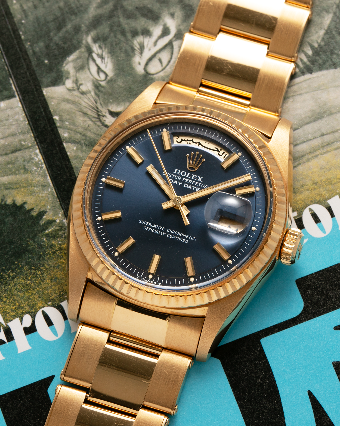 Brand: Rolex
Year: 1971
Model: Day-Date ‘Wide Boy'
Reference Number: 1803
Serial Number: 285XXXX
Material: 18-carat Yellow Gold
Movement: Rolex Cal. 1556, Self-Winding
Case Dimensions: 36mm x 12.5mm (Lug-to-Lug 43mm)
Lug Width: 20mm
Bracelet: Rolex Gay Frères Oyster Rivet Bracelet in 18-carat Yellow Gold with ‘76’ Endlinks and Signed Clasp