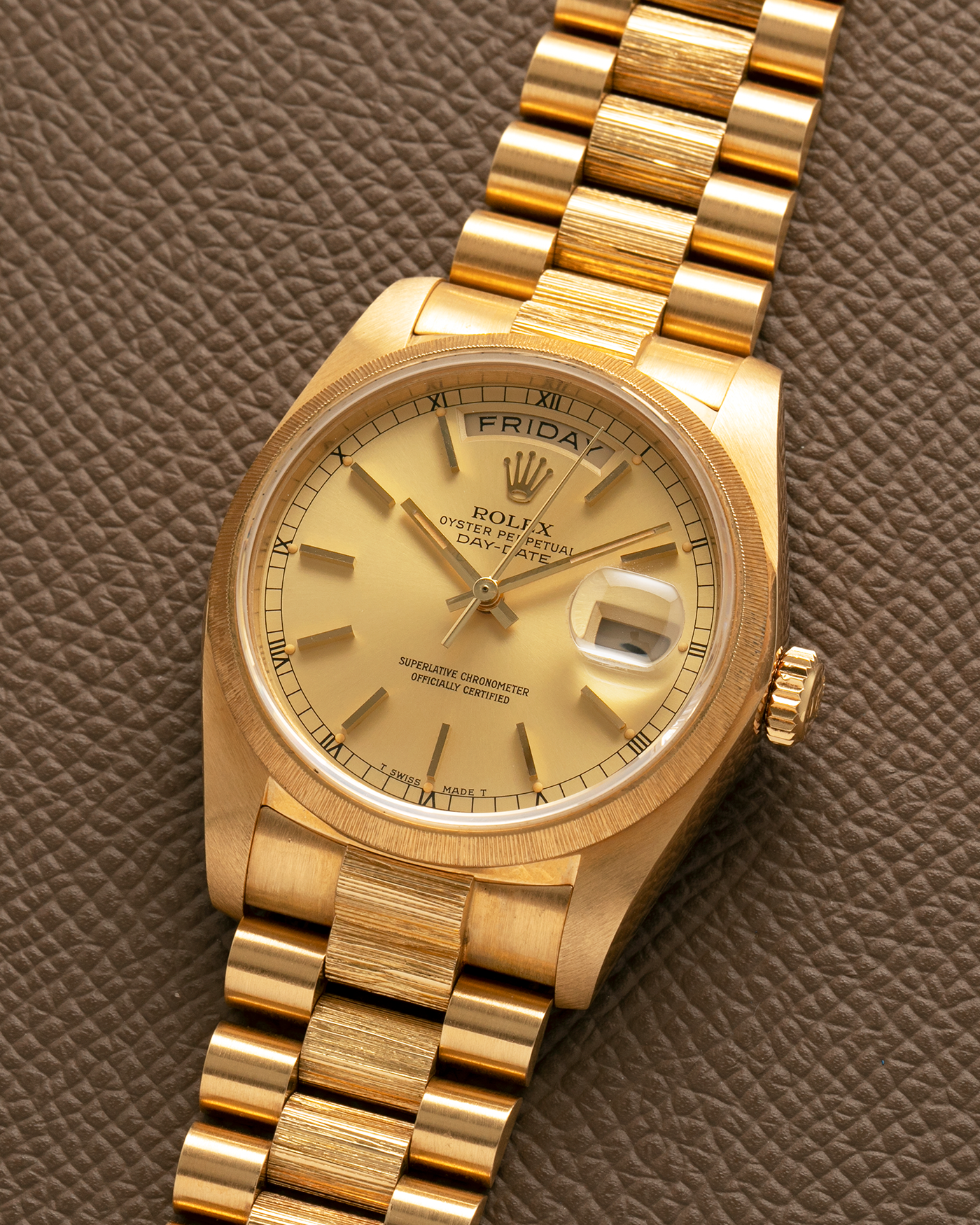 Brand: Rolex
Year: 1984
Model: Day-Date ‘Bark’
Reference Number: 18078
Serial Number: 820XXXX
Material: 18-carat Yellow Gold
Movement: Rolex Cal. 3055, Self-Winding
Case Dimensions: 36mm x 12.5mm (Lug-to-Lug 43mm)
Lug Width: 20mm
Bracelet: Rolex Presidential 8723 ‘Bark’ Bracelet with Signed 18-carat Yellow Gold Folding Clasp