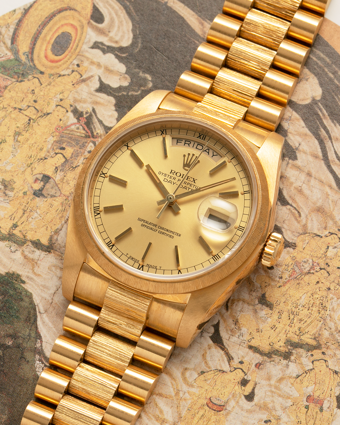 Brand: Rolex
Year: 1984
Model: Day-Date ‘Bark’
Reference Number: 18078
Serial Number: 820XXXX
Material: 18-carat Yellow Gold
Movement: Rolex Cal. 3055, Self-Winding
Case Dimensions: 36mm x 12.5mm (Lug-to-Lug 43mm)
Lug Width: 20mm
Bracelet: Rolex Presidential 8723 ‘Bark’ Bracelet with Signed 18-carat Yellow Gold Folding Clasp