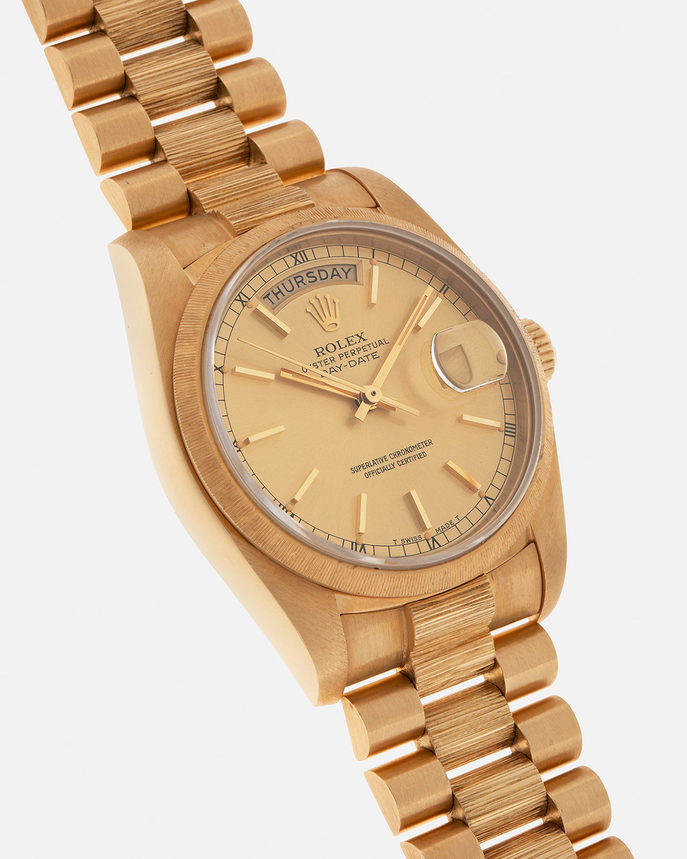 Brand: Rolex
Year: 1984
Model: Day-Date ‘Bark’
Reference Number: 18078
Serial Number: 820XXXX
Material: 18-carat Yellow Gold
Movement: Rolex Cal. 3055, Self-Winding
Case Dimensions: 36mm x 12.5mm (Lug-to-Lug 43mm)
Lug Width: 20mm
Bracelet: Rolex Presidential 8723 ‘Bark’ Bracelet with Signed 18-carat Yellow Gold Folding Clasp
