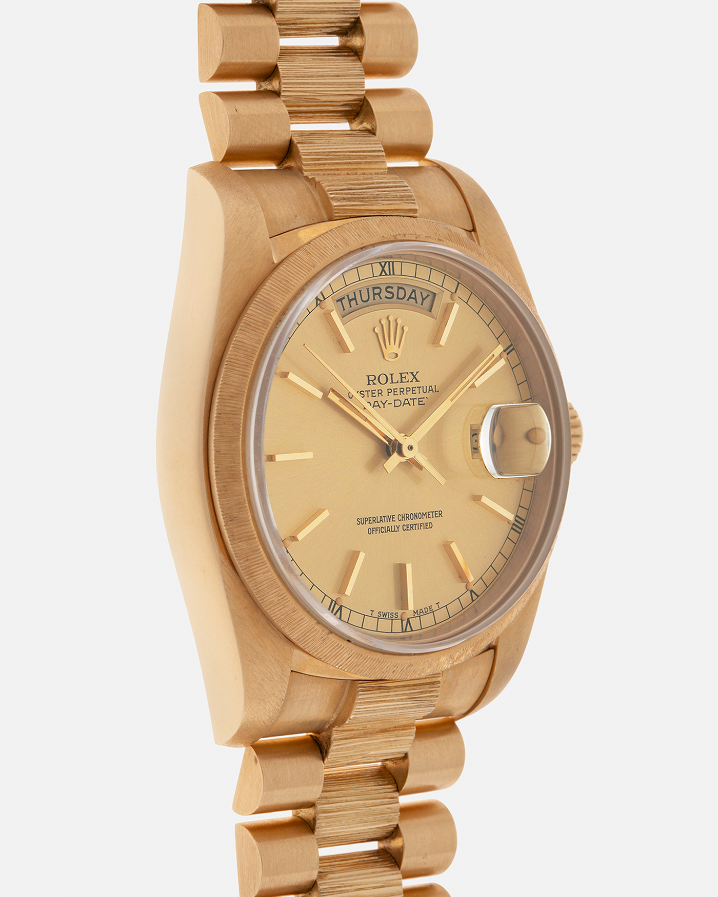Brand: Rolex
Year: 1984
Model: Day-Date ‘Bark’
Reference Number: 18078
Serial Number: 820XXXX
Material: 18-carat Yellow Gold
Movement: Rolex Cal. 3055, Self-Winding
Case Dimensions: 36mm x 12.5mm (Lug-to-Lug 43mm)
Lug Width: 20mm
Bracelet: Rolex Presidential 8723 ‘Bark’ Bracelet with Signed 18-carat Yellow Gold Folding Clasp