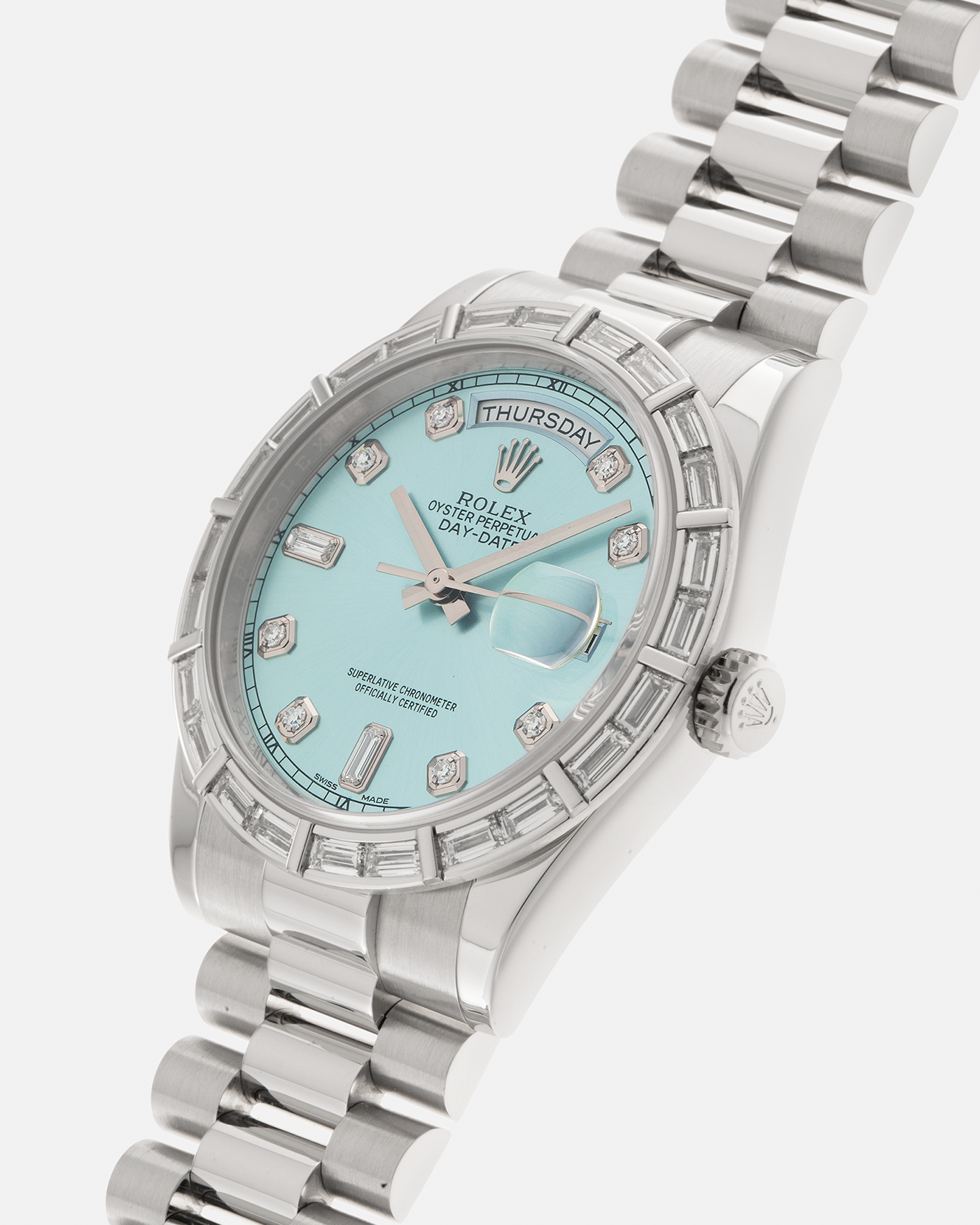 Brand: Rolex Year: 2010s Model: Day-Date 36 ‘Ice Blue’ Baguette Bezel Reference Number: 118366 Material: Platinum 950 Case, Factory Set Baguette Diamond Bezel and Diamond Hour Markers Movement: Rolex Cal. 3155, Self-Winding Case Diameter: 36mm Bracelet: Rolex Presidential Bracelet in Platinum 950