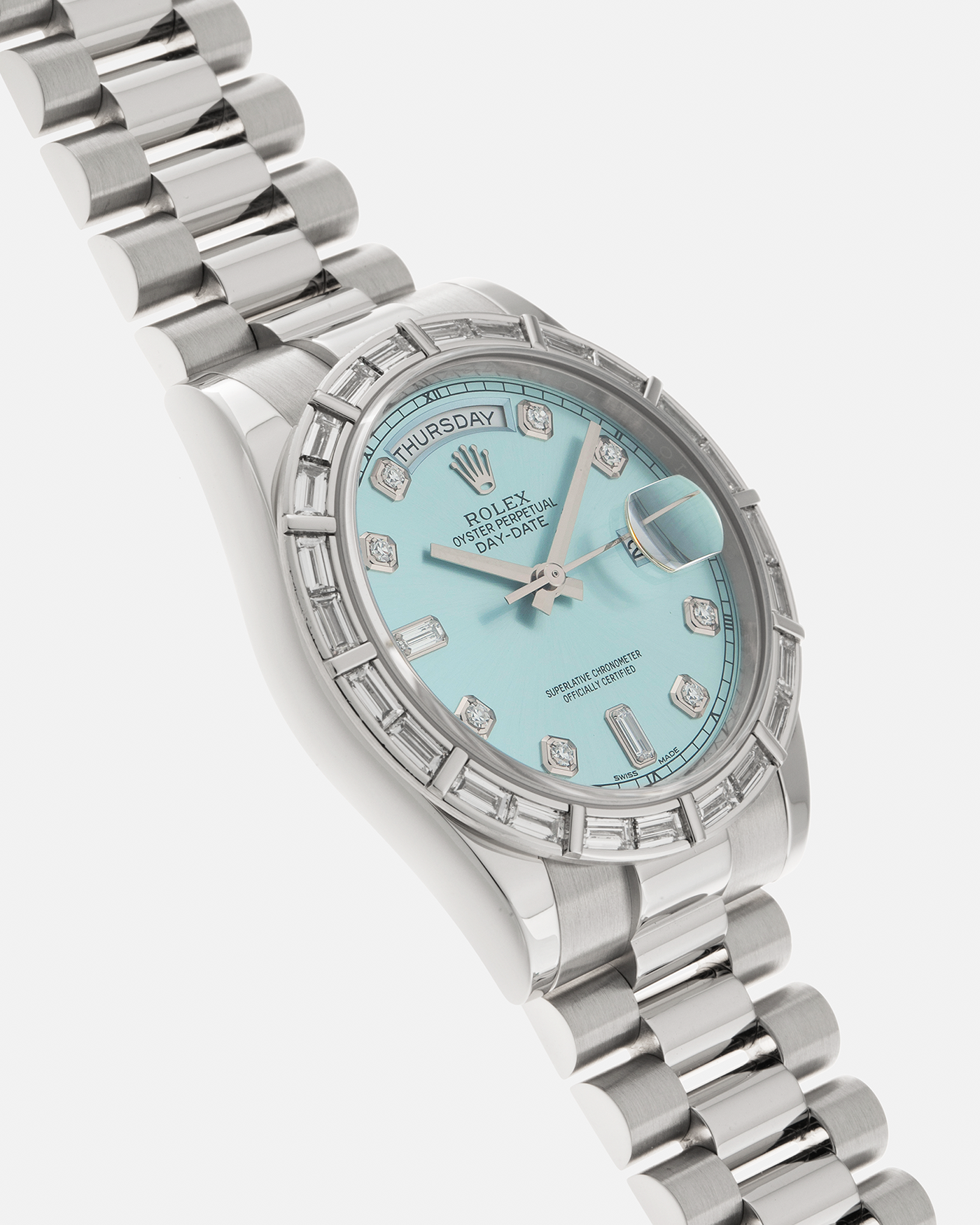 Brand: Rolex Year: 2010s Model: Day-Date 36 ‘Ice Blue’ Baguette Bezel Reference Number: 118366 Material: Platinum 950 Case, Factory Set Baguette Diamond Bezel and Diamond Hour Markers Movement: Rolex Cal. 3155, Self-Winding Case Diameter: 36mm Bracelet: Rolex Presidential Bracelet in Platinum 950