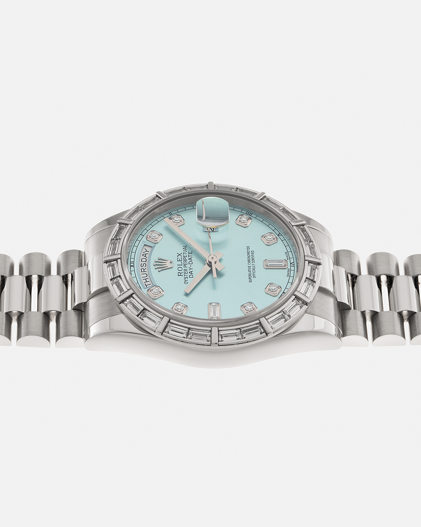 Brand: Rolex Year: 2010s Model: Day-Date 36 ‘Ice Blue’ Baguette Bezel Reference Number: 118366 Material: Platinum 950 Case, Factory Set Baguette Diamond Bezel and Diamond Hour Markers Movement: Rolex Cal. 3155, Self-Winding Case Diameter: 36mm Bracelet: Rolex Presidential Bracelet in Platinum 950