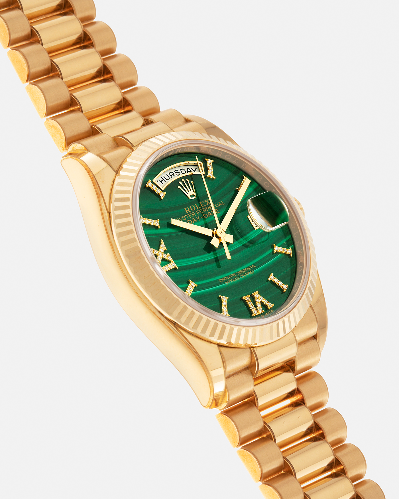 Brand: Rolex Year: 2021 Model: Day-Date 36 ‘Malachite Diamond’ Reference Number: 128238 Serial Number: 6H47XXXX Material: 18-carat Yellow Gold Case, Green Malachite Dial, Factory Set Diamond Roman-Style Hour Markers Movement: Rolex Cal. 3255, Self-Winding Case Diameter: 36mm Bracelet: Rolex Presidential Bracelet in 18-carat Yellow Gold