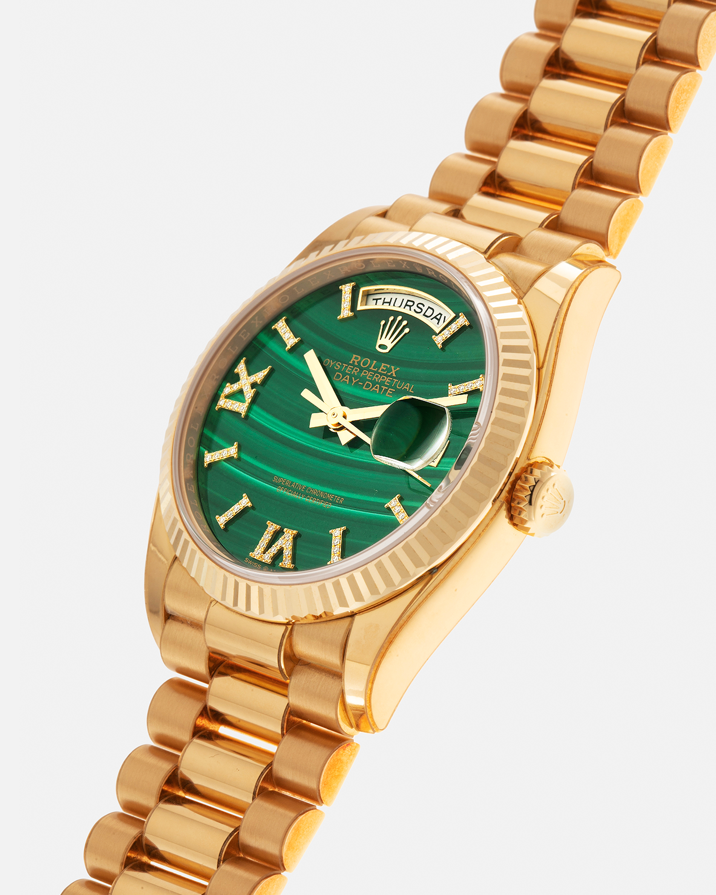 Brand: Rolex Year: 2021 Model: Day-Date 36 ‘Malachite Diamond’ Reference Number: 128238 Serial Number: 6H47XXXX Material: 18-carat Yellow Gold Case, Green Malachite Dial, Factory Set Diamond Roman-Style Hour Markers Movement: Rolex Cal. 3255, Self-Winding Case Diameter: 36mm Bracelet: Rolex Presidential Bracelet in 18-carat Yellow Gold