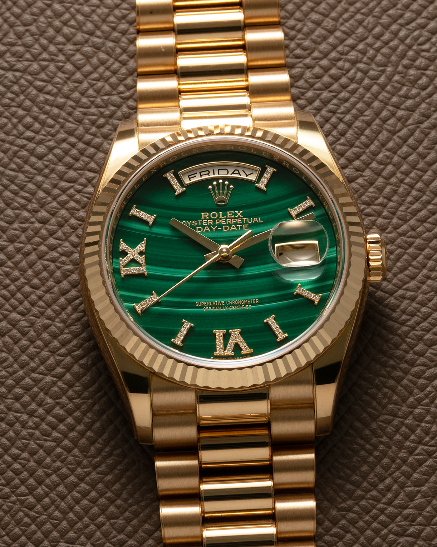 Brand: Rolex Year: 2021 Model: Day-Date 36 ‘Malachite Diamond’ Reference Number: 128238 Serial Number: 6H47XXXX Material: 18-carat Yellow Gold Case, Green Malachite Dial, Factory Set Diamond Roman-Style Hour Markers Movement: Rolex Cal. 3255, Self-Winding Case Diameter: 36mm Bracelet: Rolex Presidential Bracelet in 18-carat Yellow Gold