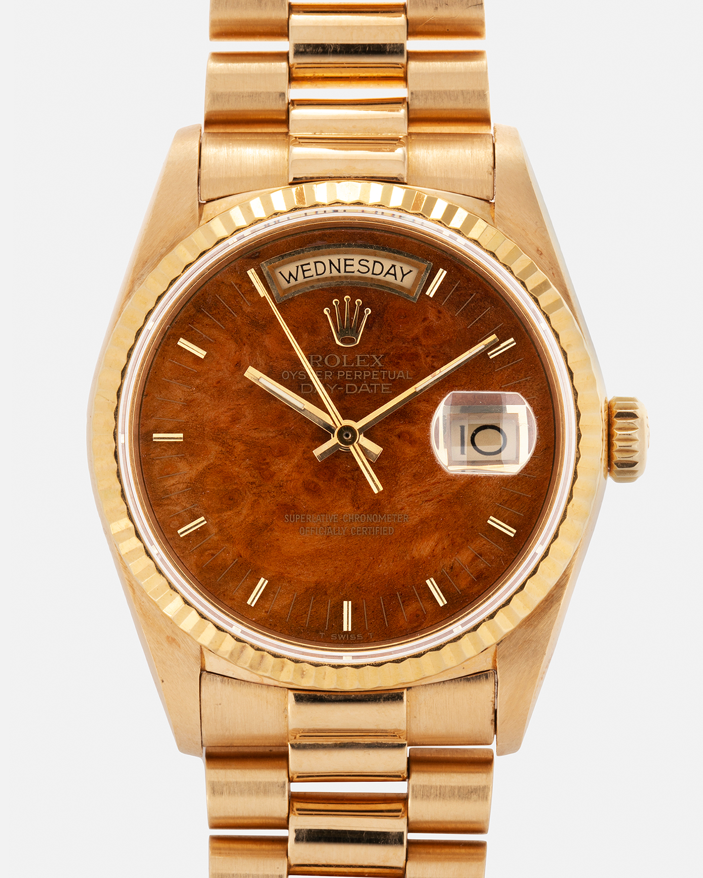 Brand: Rolex Year: 1988 Model: Day Date Reference Number: 18038 Serial Number: R586XXX Material: 18-carat Yellow Gold, ‘Burl Wood’ Dial Movement: Rolex Cal. 3055, Self-Winding Case Diameter: 36mm Lug Width: 20mm Bracelet: Rolex 18-carat Yellow Gold 8385 Presidential Bracelet with 55 Curved End Links