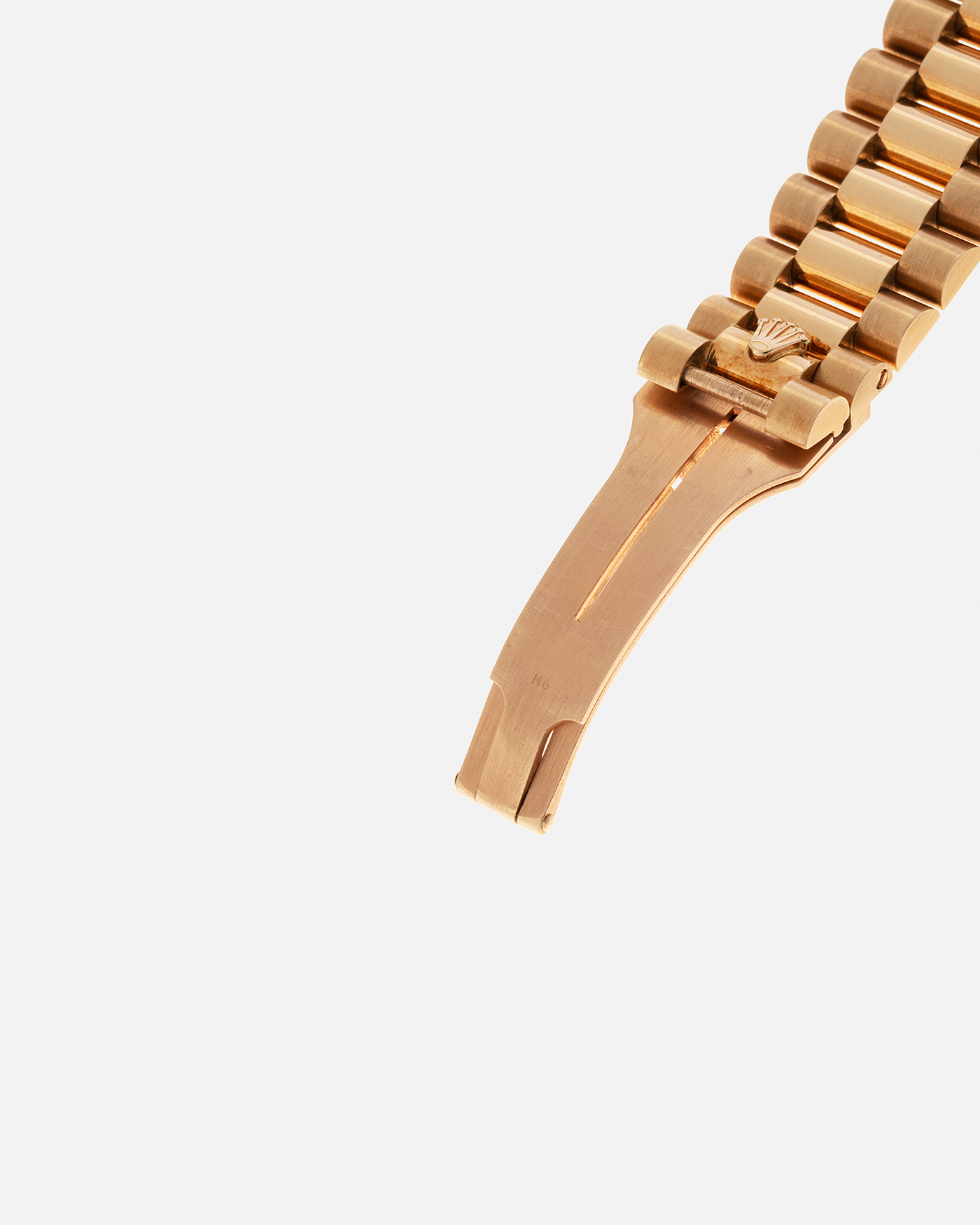 Brand: Rolex
Year: 1979
Model: Day-Date
Reference Number: 18038
Serial: 6217XXX
Material: 18-carat Yellow Gold
Movement: Rolex Cal. 3055, Self-Winding
Case Diameter: 36mm x 12mm (43mm Lug-to-Lug)
Lug Width: 20mm
Bracelet:  Rolex ‘8385’ 18-carat Yellow Gold Presidential Bracelet with ‘55’ Curved End Links and Signed Clasp