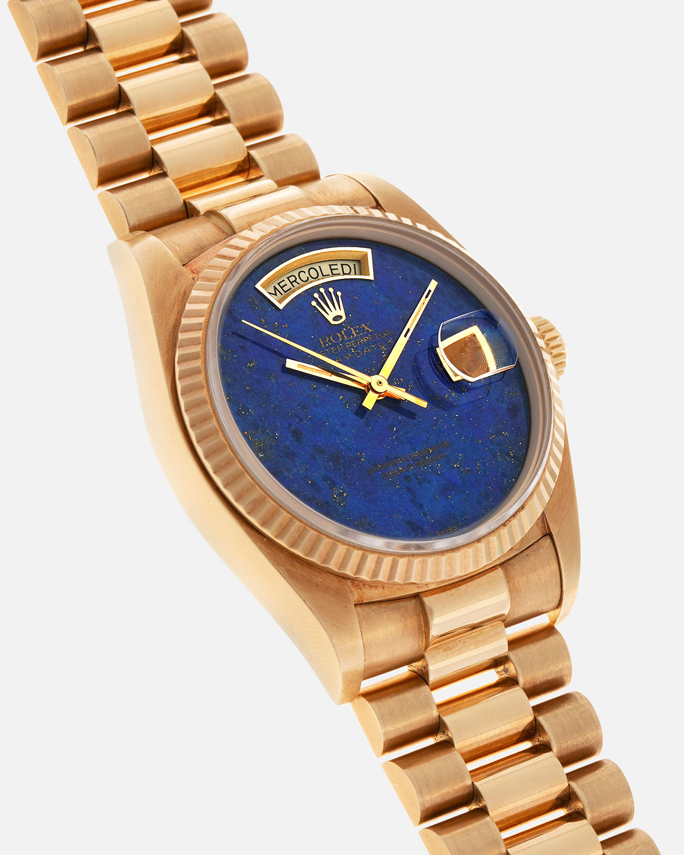 Brand: Rolex
Year: 1979
Model: Day-Date
Reference Number: 18038
Serial: 6217XXX
Material: 18-carat Yellow Gold
Movement: Rolex Cal. 3055, Self-Winding
Case Diameter: 36mm x 12mm (43mm Lug-to-Lug)
Lug Width: 20mm
Bracelet:  Rolex ‘8385’ 18-carat Yellow Gold Presidential Bracelet with ‘55’ Curved End Links and Signed Clasp