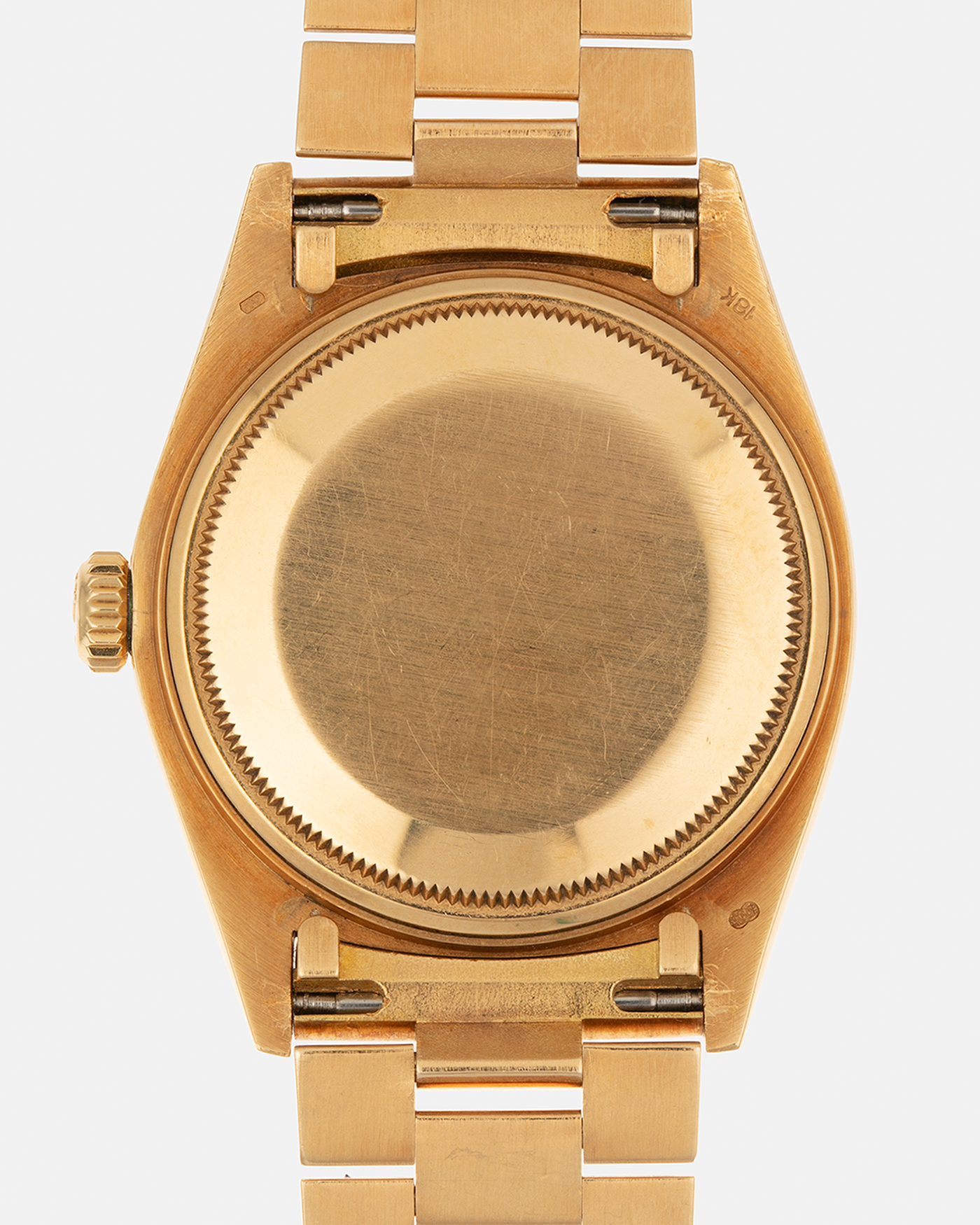 Brand: Rolex
Year: 1979
Model: Day-Date
Reference Number: 18038
Serial: 6217XXX
Material: 18-carat Yellow Gold
Movement: Rolex Cal. 3055, Self-Winding
Case Diameter: 36mm x 12mm (43mm Lug-to-Lug)
Lug Width: 20mm
Bracelet:  Rolex ‘8385’ 18-carat Yellow Gold Presidential Bracelet with ‘55’ Curved End Links and Signed Clasp