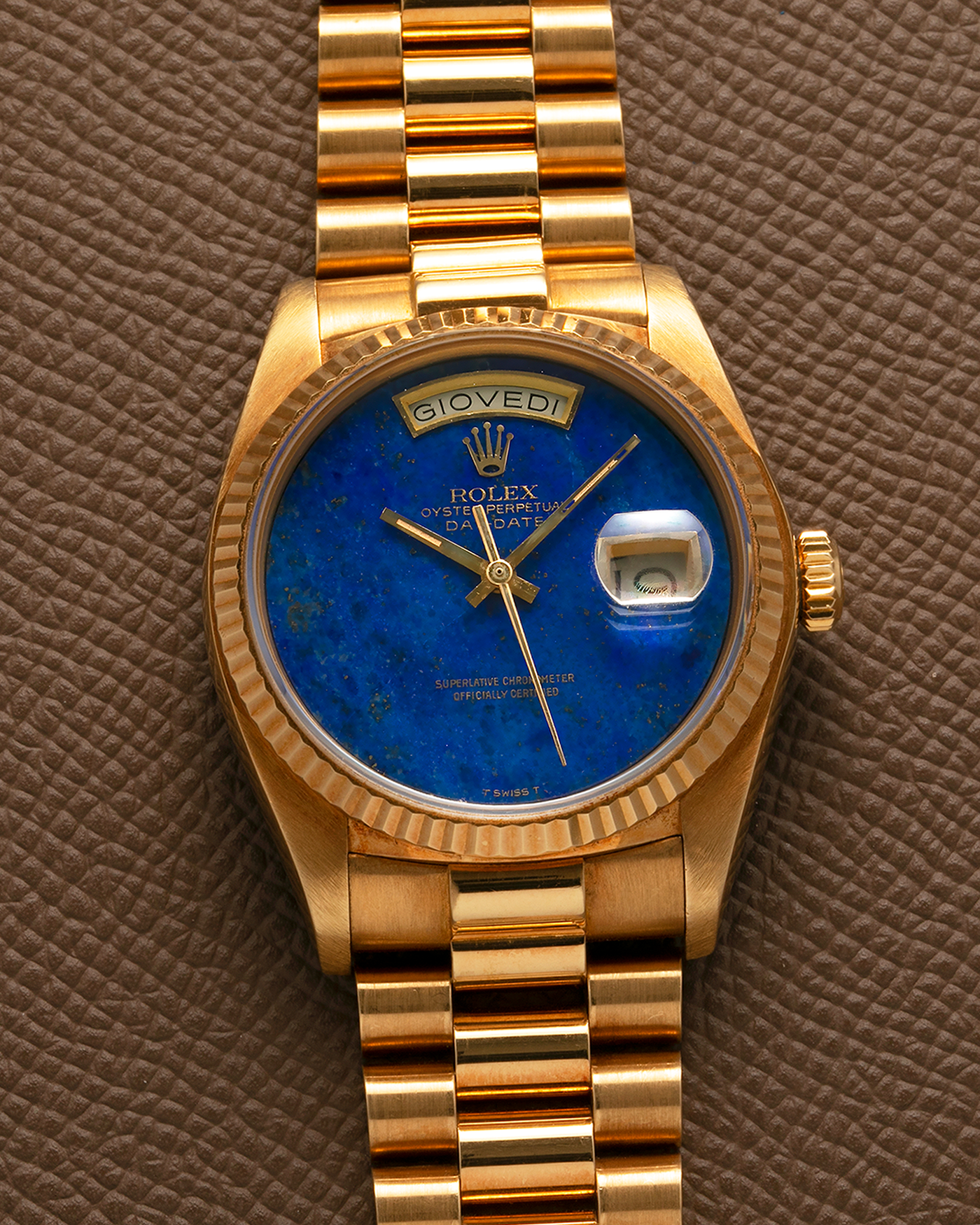 Brand: Rolex
Year: 1979
Model: Day-Date
Reference Number: 18038
Serial: 6217XXX
Material: 18-carat Yellow Gold
Movement: Rolex Cal. 3055, Self-Winding
Case Diameter: 36mm x 12mm (43mm Lug-to-Lug)
Lug Width: 20mm
Bracelet:  Rolex ‘8385’ 18-carat Yellow Gold Presidential Bracelet with ‘55’ Curved End Links and Signed Clasp