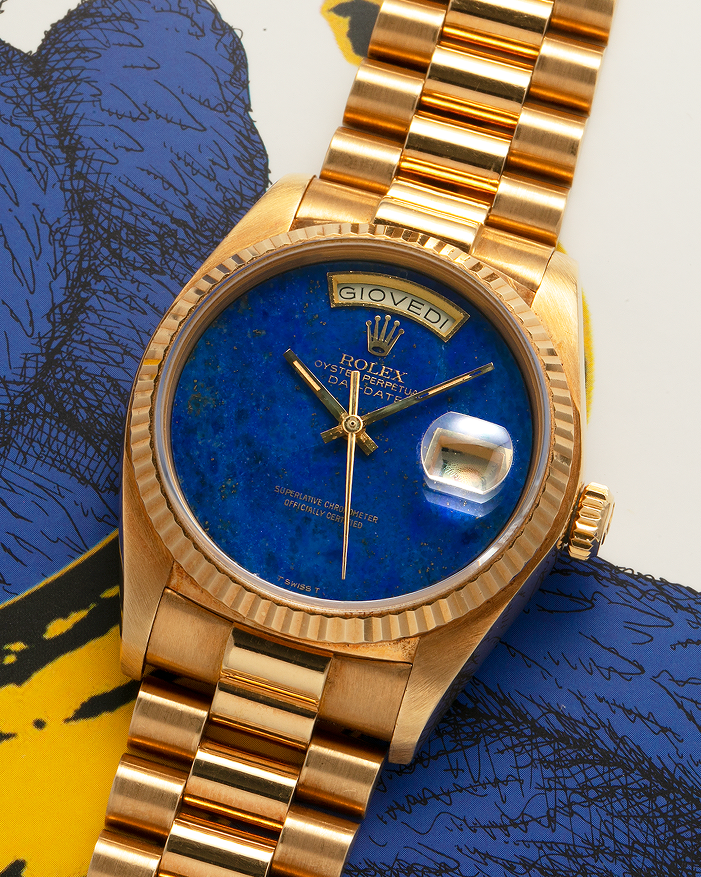 Brand: Rolex
Year: 1979
Model: Day-Date
Reference Number: 18038
Serial: 6217XXX
Material: 18-carat Yellow Gold
Movement: Rolex Cal. 3055, Self-Winding
Case Diameter: 36mm x 12mm (43mm Lug-to-Lug)
Lug Width: 20mm
Bracelet:  Rolex ‘8385’ 18-carat Yellow Gold Presidential Bracelet with ‘55’ Curved End Links and Signed Clasp