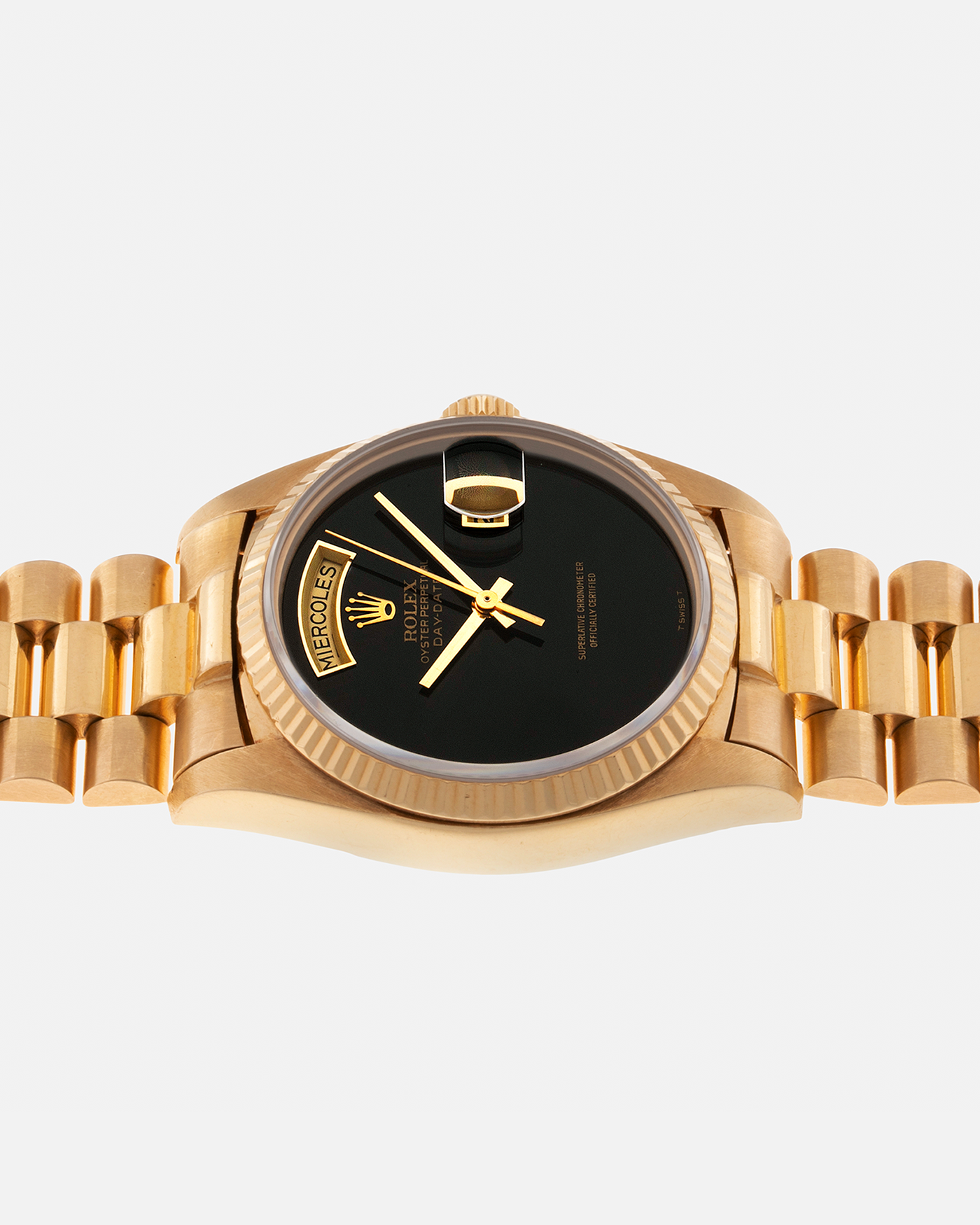 Brand: Rolex Year: 1979 Model: Day-Date, ‘Onyx’ Reference Number: 18038 Serial: 625XXXX Material: 18-carat Yellow Gold, Black Onyx Dial Movement: Rolex Cal. 3055, Self-Winding Case Diameter: 36mm Lug Width: 20mm Bracelet: Rolex ‘8385’ 18-carat Yellow Gold Presidential Bracelet with ‘55’ Curved End Links