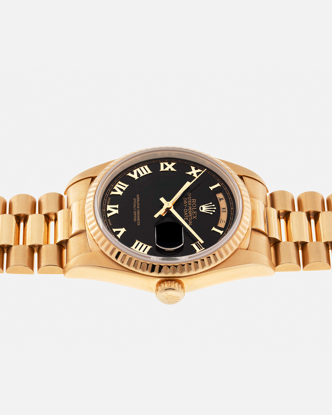 Brand: Rolex
Year: 1989
Model: Day-Date ‘Black Pyramid’
Reference Number: 18238
Serial Number: L551XXX
Material: 18-carat Yellow Gold
Movement: Rolex Cal. 3155, Self-Winding
Case Diameter: 36mm (Lug-to-Lug 43.7mm)
Lug Width: 20mm
Bracelet: Rolex 18-carat Yellow Gold ‘8385’ Presidential Bracelet with 55B Curved End Links and Signed ‘N8’ Folding Clasp