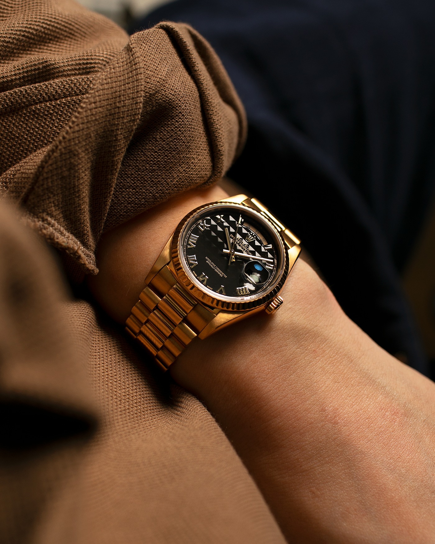 Brand: Rolex
Year: 1989
Model: Day-Date ‘Black Pyramid’
Reference Number: 18238
Serial Number: L551XXX
Material: 18-carat Yellow Gold
Movement: Rolex Cal. 3155, Self-Winding
Case Diameter: 36mm (Lug-to-Lug 43.7mm)
Lug Width: 20mm
Bracelet: Rolex 18-carat Yellow Gold ‘8385’ Presidential Bracelet with 55B Curved End Links and Signed ‘N8’ Folding Clasp