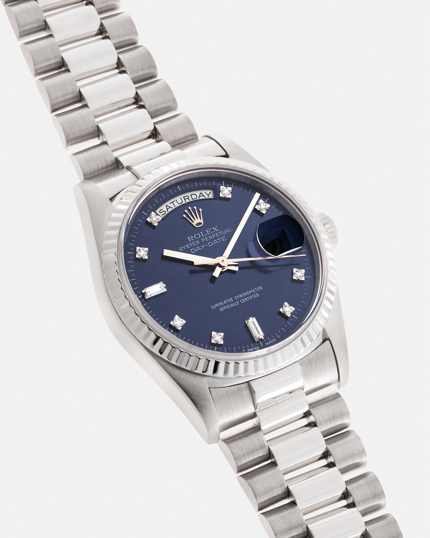 Brand: Rolex Year: 1993 Model: Day-Date Reference Number: 18239 Serial Number: X269XXX Material: 18-carat White Gold, Factory Set Diamond Hour Markers Movement: Rolex Cal. 3155, Self-Winding Case Diameter: 36mm Bracelet: Rolex 18-carat White Gold 8385 Presidential Bracelet with 55B Curved End Links