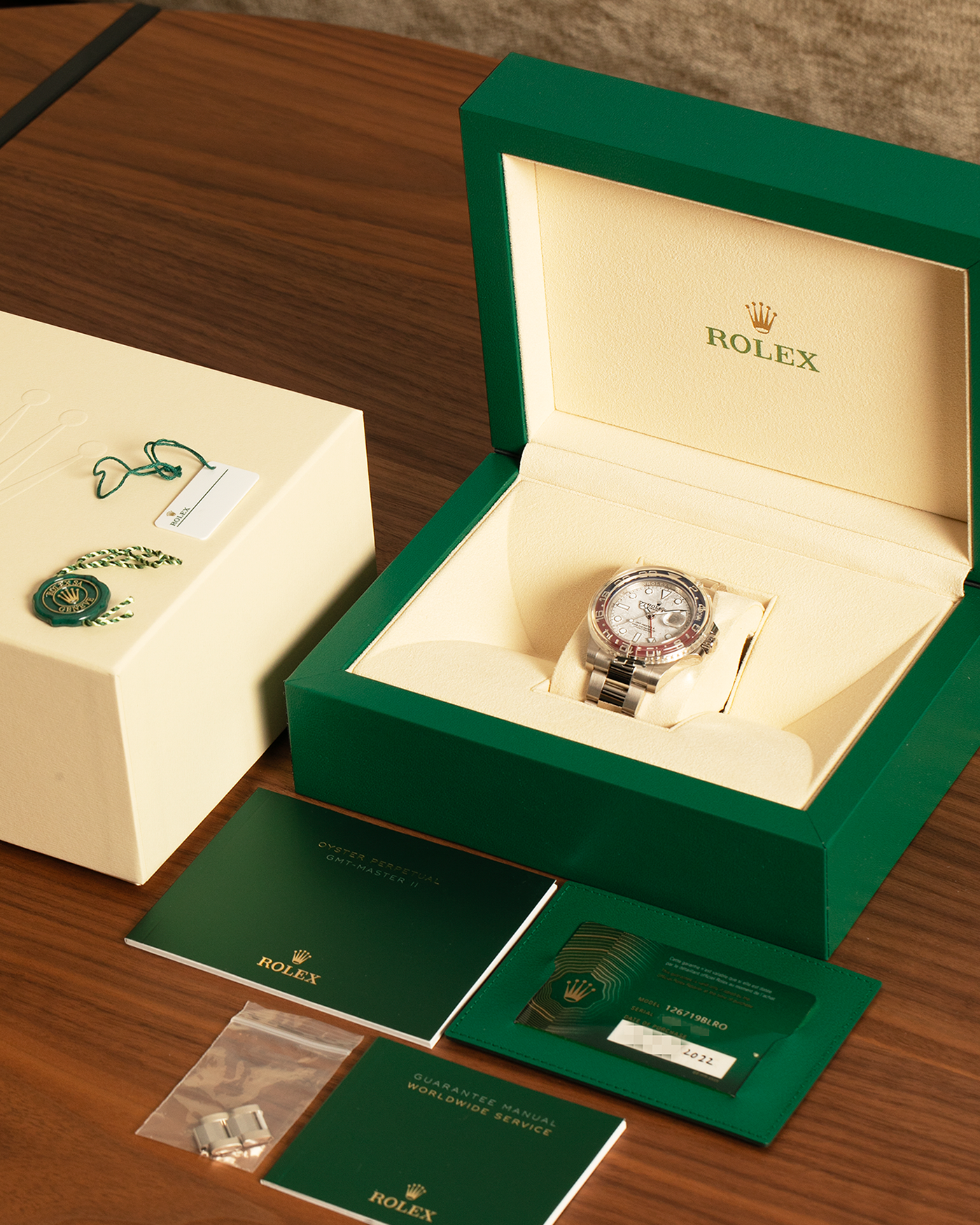 Brand: Rolex
Year: 2022
Model: GMT Master II
Reference Number: 126719BLRO
Material: 18-carat White Gold
Movement: Rolex Cal. 3285, Self-Winding
Case Dimensions: 40mm Diameter 12.3mm Thickness
Lug Width: 20mm
Bracelet: Rolex Oyster Bracelet in 18-carat White Gold with Signed Oysterlock Folding Clasp