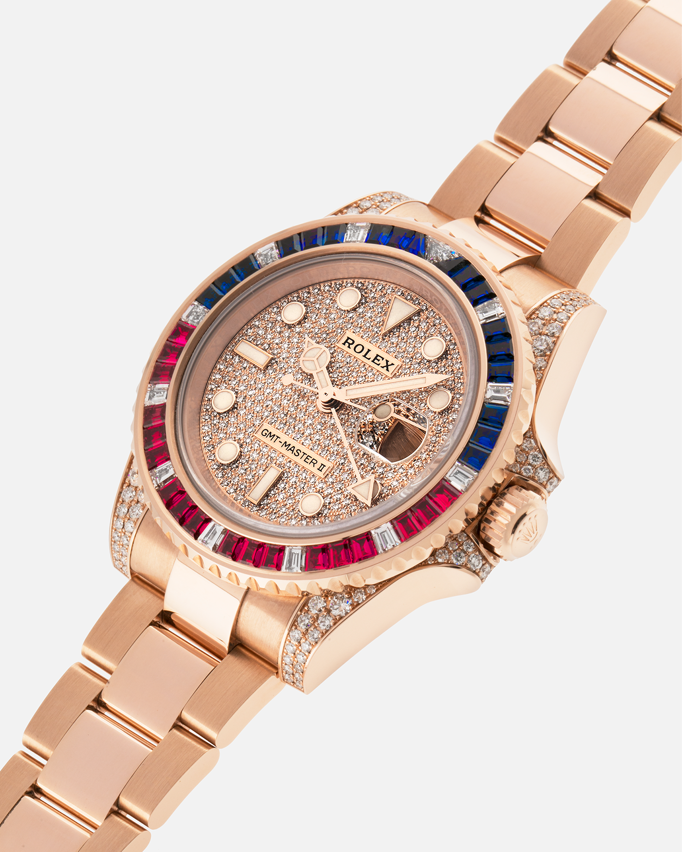 Brand: Rolex
Year: 2020
Model: GMT Master II
Reference Number: 126755SARU
Material: 18-carat Everose, Rubies And Sapphire Bezel, Diamond Pavé Lugs and Crown Guards, Diamond Pavé Dial
Movement: Rolex Cal. 3285, Self-Winding
Case Dimensions: 40mm Diameter 12.3mm Thickness
Lug Width: 20mm
Bracelet: Rolex Oyster Bracelet in 18-carat Everose with Signed Oysterlock Folding Clasp