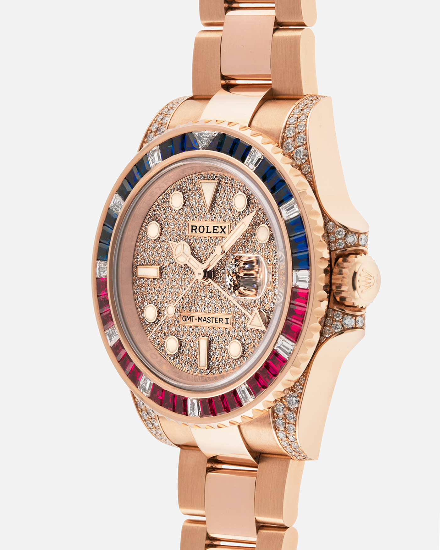 Brand: Rolex
Year: 2020
Model: GMT Master II
Reference Number: 126755SARU
Material: 18-carat Everose, Rubies And Sapphire Bezel, Diamond Pavé Lugs and Crown Guards, Diamond Pavé Dial
Movement: Rolex Cal. 3285, Self-Winding
Case Dimensions: 40mm Diameter 12.3mm Thickness
Lug Width: 20mm
Bracelet: Rolex Oyster Bracelet in 18-carat Everose with Signed Oysterlock Folding Clasp