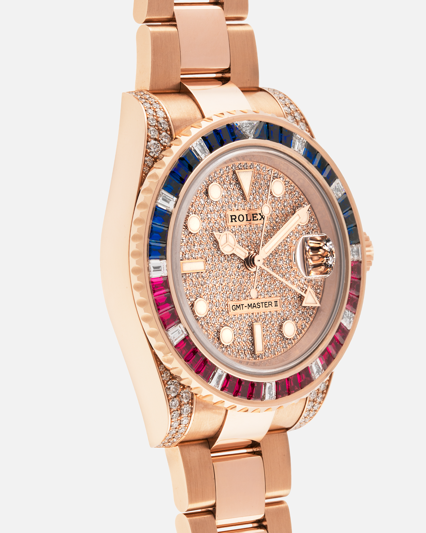 Brand: Rolex
Year: 2020
Model: GMT Master II
Reference Number: 126755SARU
Material: 18-carat Everose, Rubies And Sapphire Bezel, Diamond Pavé Lugs and Crown Guards, Diamond Pavé Dial
Movement: Rolex Cal. 3285, Self-Winding
Case Dimensions: 40mm Diameter 12.3mm Thickness
Lug Width: 20mm
Bracelet: Rolex Oyster Bracelet in 18-carat Everose with Signed Oysterlock Folding Clasp