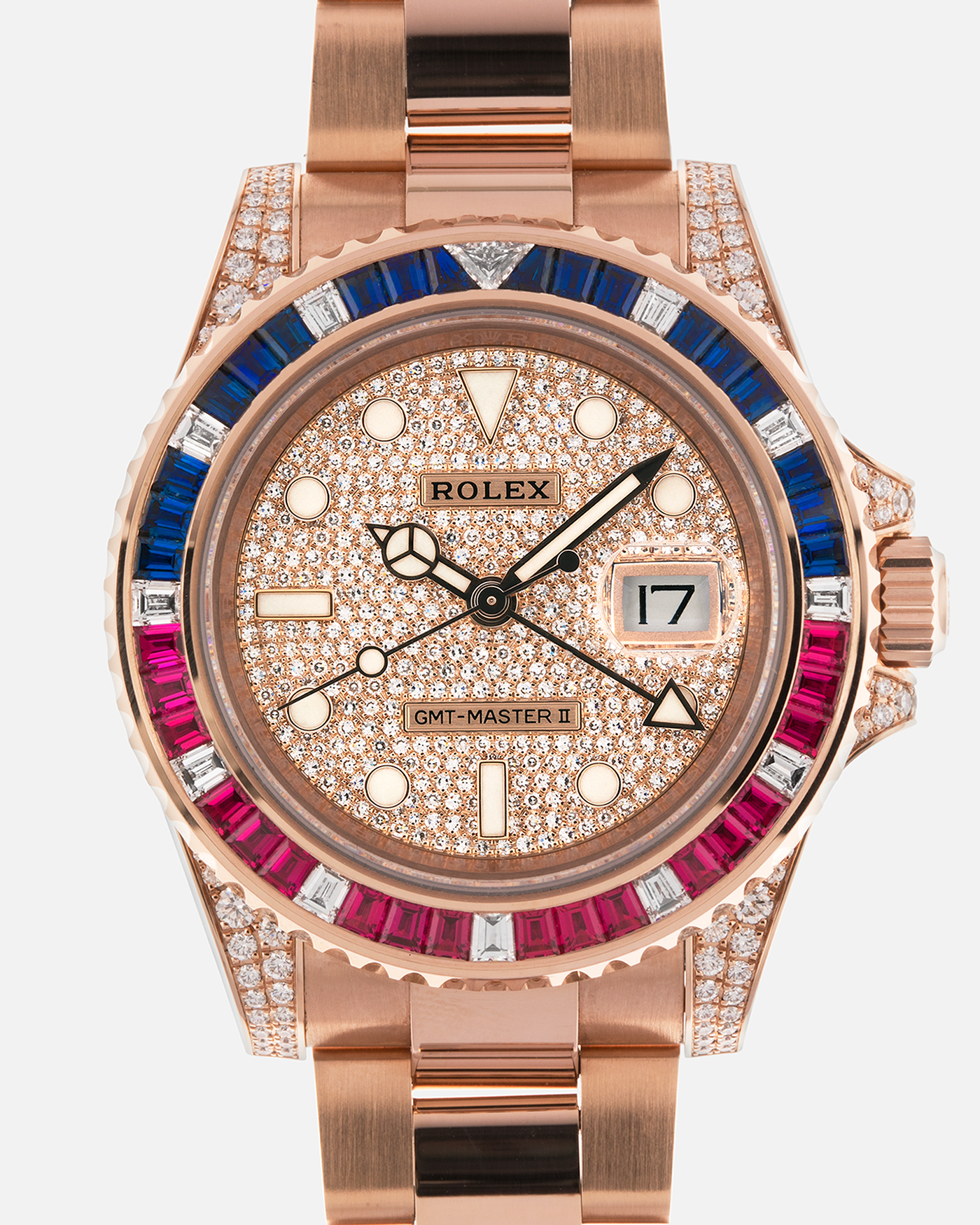 Brand: Rolex
Year: 2020
Model: GMT Master II
Reference Number: 126755SARU
Material: 18-carat Everose, Rubies And Sapphire Bezel, Diamond Pavé Lugs and Crown Guards, Diamond Pavé Dial
Movement: Rolex Cal. 3285, Self-Winding
Case Dimensions: 40mm Diameter 12.3mm Thickness
Lug Width: 20mm
Bracelet: Rolex Oyster Bracelet in 18-carat Everose with Signed Oysterlock Folding Clasp