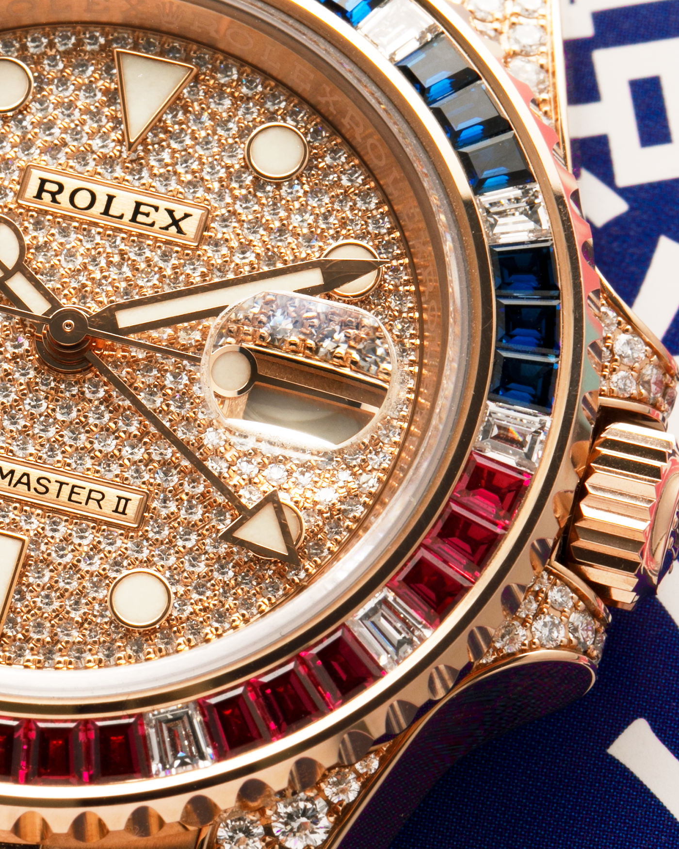 Brand: Rolex
Year: 2020
Model: GMT Master II
Reference Number: 126755SARU
Material: 18-carat Everose, Rubies And Sapphire Bezel, Diamond Pavé Lugs and Crown Guards, Diamond Pavé Dial
Movement: Rolex Cal. 3285, Self-Winding
Case Dimensions: 40mm Diameter 12.3mm Thickness
Lug Width: 20mm
Bracelet: Rolex Oyster Bracelet in 18-carat Everose with Signed Oysterlock Folding Clasp