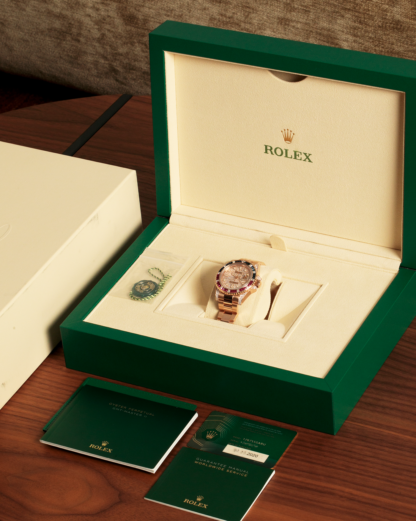 Brand: Rolex
Year: 2020
Model: GMT Master II
Reference Number: 126755SARU
Material: 18-carat Everose, Rubies And Sapphire Bezel, Diamond Pavé Lugs and Crown Guards, Diamond Pavé Dial
Movement: Rolex Cal. 3285, Self-Winding
Case Dimensions: 40mm Diameter 12.3mm Thickness
Lug Width: 20mm
Bracelet: Rolex Oyster Bracelet in 18-carat Everose with Signed Oysterlock Folding Clasp