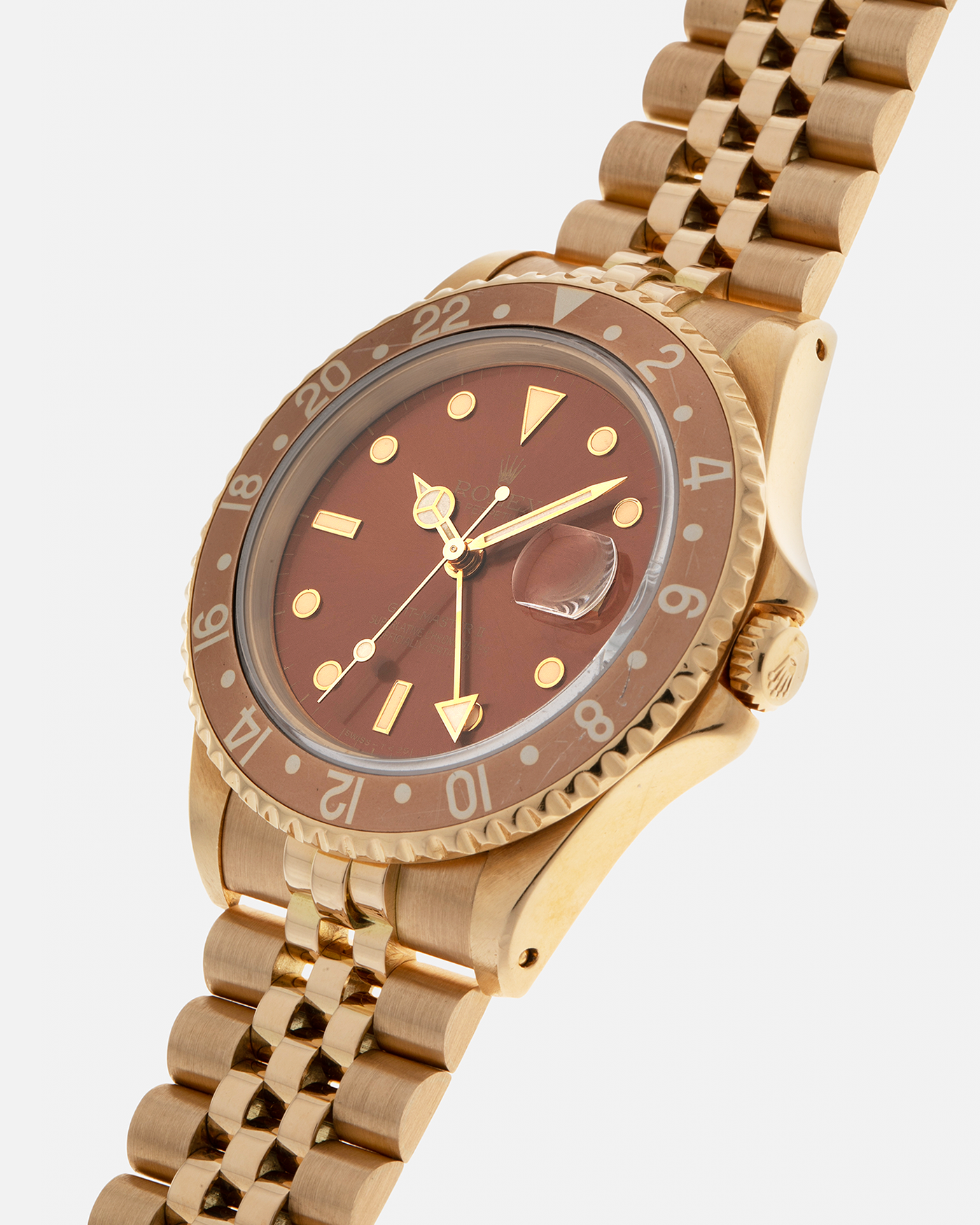 Brand: Rolex
Year: 1994
Model: GMT Master II
Reference Number: 16718
Serial Number: N281XXX
Material: 18-carat Yellow Gold
Movement: Rolex Cal. 3185, Self-Winding
Case Dimensions: 40mm x 12mm (Lug-to-Lug 42.5mm)
Lug Width: 20mm
Bracelet: Rolex 18-carat Yellow Gold 8386 Jubilee Bracelet with 47B Curved End Links