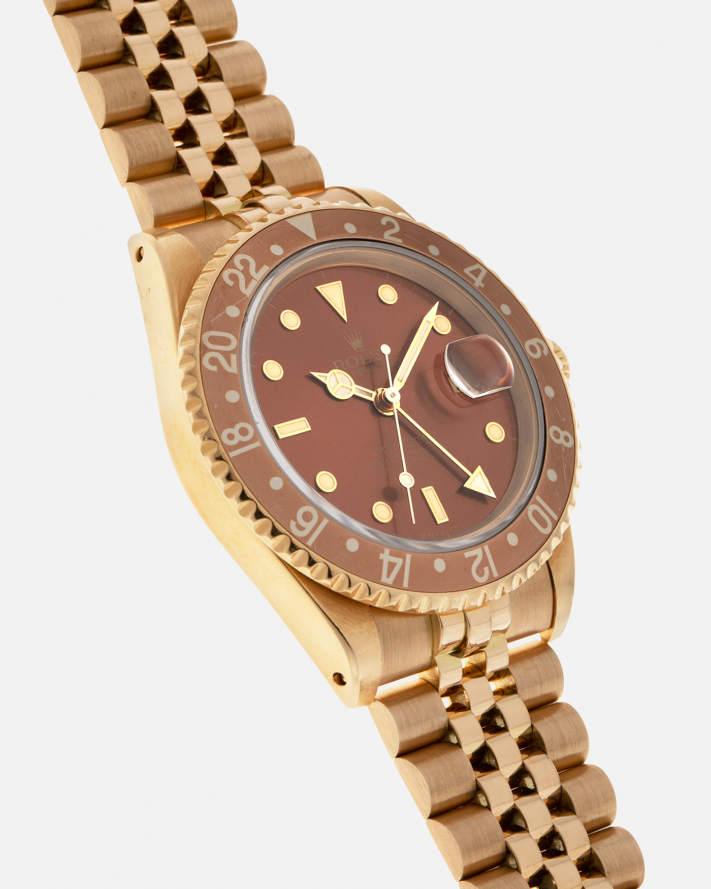 Brand: Rolex
Year: 1994
Model: GMT Master II
Reference Number: 16718
Serial Number: N281XXX
Material: 18-carat Yellow Gold
Movement: Rolex Cal. 3185, Self-Winding
Case Dimensions: 40mm x 12mm (Lug-to-Lug 42.5mm)
Lug Width: 20mm
Bracelet: Rolex 18-carat Yellow Gold 8386 Jubilee Bracelet with 47B Curved End Links
