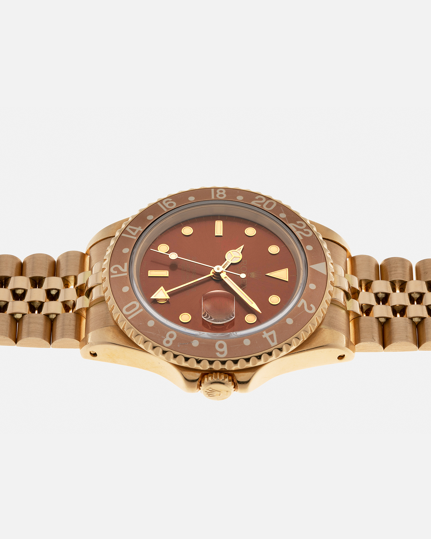 Brand: Rolex
Year: 1994
Model: GMT Master II
Reference Number: 16718
Serial Number: N281XXX
Material: 18-carat Yellow Gold
Movement: Rolex Cal. 3185, Self-Winding
Case Dimensions: 40mm x 12mm (Lug-to-Lug 42.5mm)
Lug Width: 20mm
Bracelet: Rolex 18-carat Yellow Gold 8386 Jubilee Bracelet with 47B Curved End Links