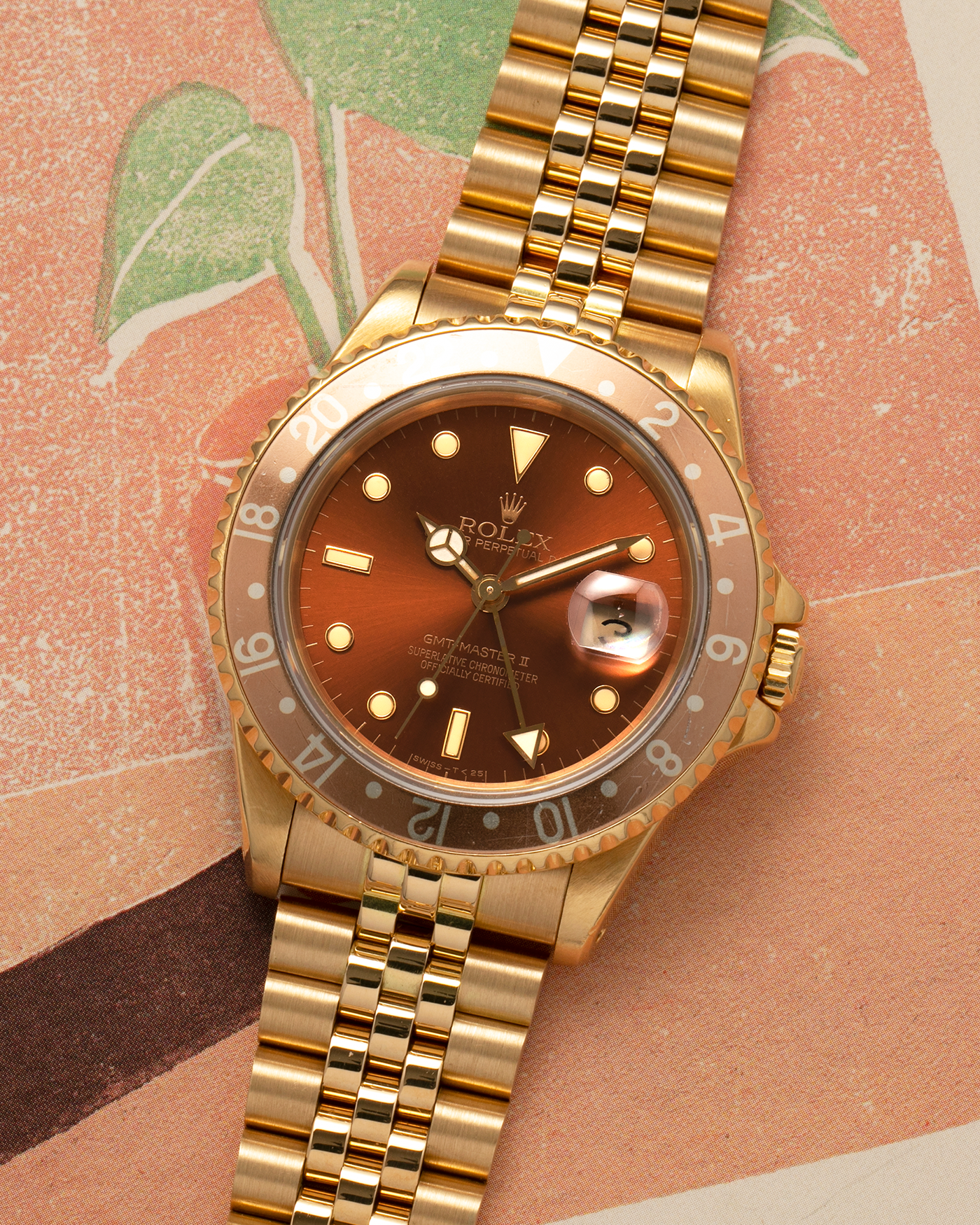 Brand: Rolex
Year: 1994
Model: GMT Master II
Reference Number: 16718
Serial Number: N281XXX
Material: 18-carat Yellow Gold
Movement: Rolex Cal. 3185, Self-Winding
Case Dimensions: 40mm x 12mm (Lug-to-Lug 42.5mm)
Lug Width: 20mm
Bracelet: Rolex 18-carat Yellow Gold 8386 Jubilee Bracelet with 47B Curved End Links