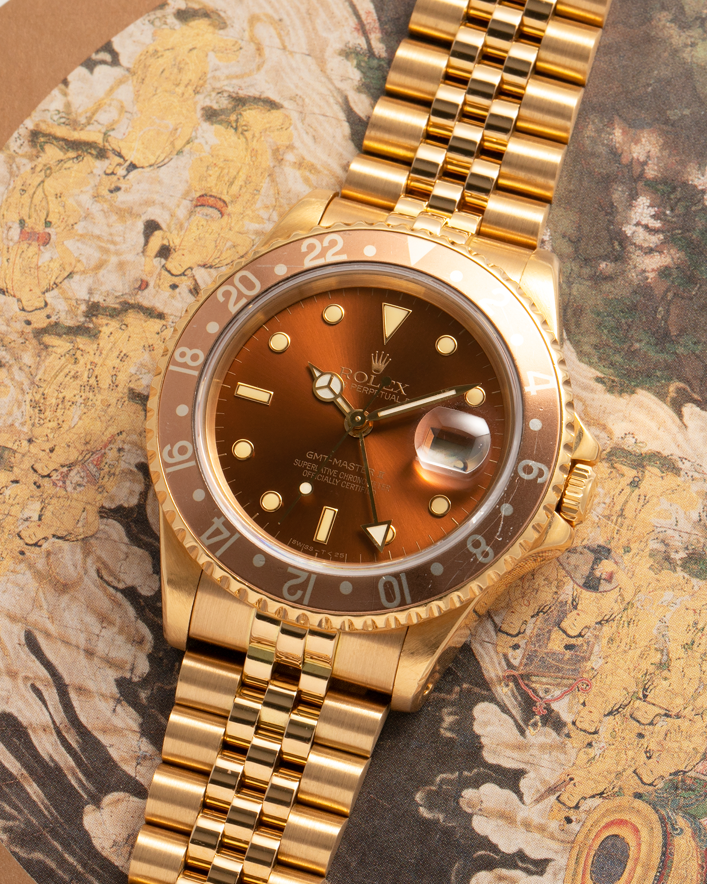 Brand: Rolex
Year: 1994
Model: GMT Master II
Reference Number: 16718
Serial Number: N281XXX
Material: 18-carat Yellow Gold
Movement: Rolex Cal. 3185, Self-Winding
Case Dimensions: 40mm x 12mm (Lug-to-Lug 42.5mm)
Lug Width: 20mm
Bracelet: Rolex 18-carat Yellow Gold 8386 Jubilee Bracelet with 47B Curved End Links