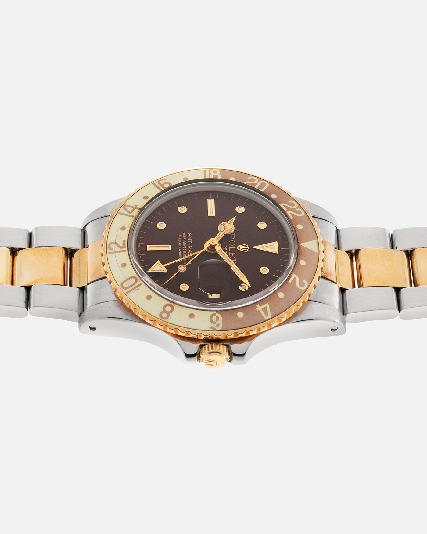Brand: Rolex Year: 1975 Model: GMT-Master “Root Beer Nipple Dial” Reference Number: 1675 Serial Number: 399XXXX Material: Two-Tone Stainless Steel and Gold Case, Aluminum Bezel Insert Movement: Rolex Cal. 1575, Self-Winding Case Diameter: 39.5mm Lug Width: 20mm Bracelet: Rolex Two-Tone Stainless Steel and Gold ‘78363’ Folded Oyster Bracelet with Signed ‘VC’ Stainless Steel Clasp and ‘480’ Curved End Links