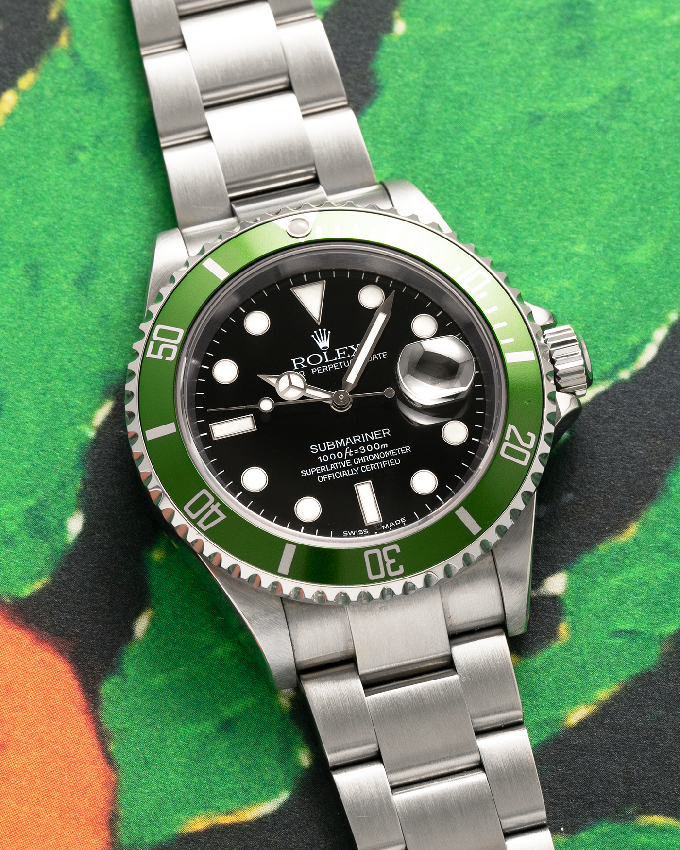 Brand: Rolex
Year: 2003
Model: Submariner ‘Kermit’
Reference Number: 16610LV
Serial Number: F Serial
Material: Stainless Steel
Movement: Cal. 3135
Case Diameter: 40mm
Lug Width: 20mm
Bracelet/Strap: Rolex 93250 Bracelet with AD9 Clasp Code