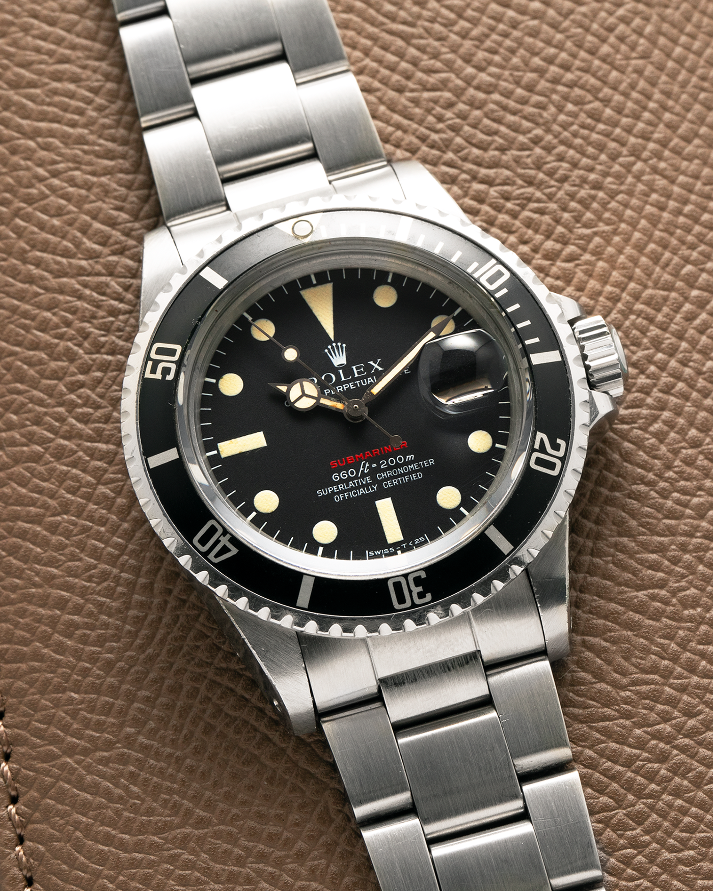 Brand: Rolex
Year: 1976
Model: Submariner
Reference Number: 1680 ‘Red’
Serial Number: 38XXXXX
Material: Stainless Steel
Movement: Rolex Cal. 1575, Self-Winding
Case Dimensions: 40mm
Lug Width: 20mm
Bracelet: Rolex 93150 Oyster Bracelet with Signed Stainless Steel Clasp and XXX End Links