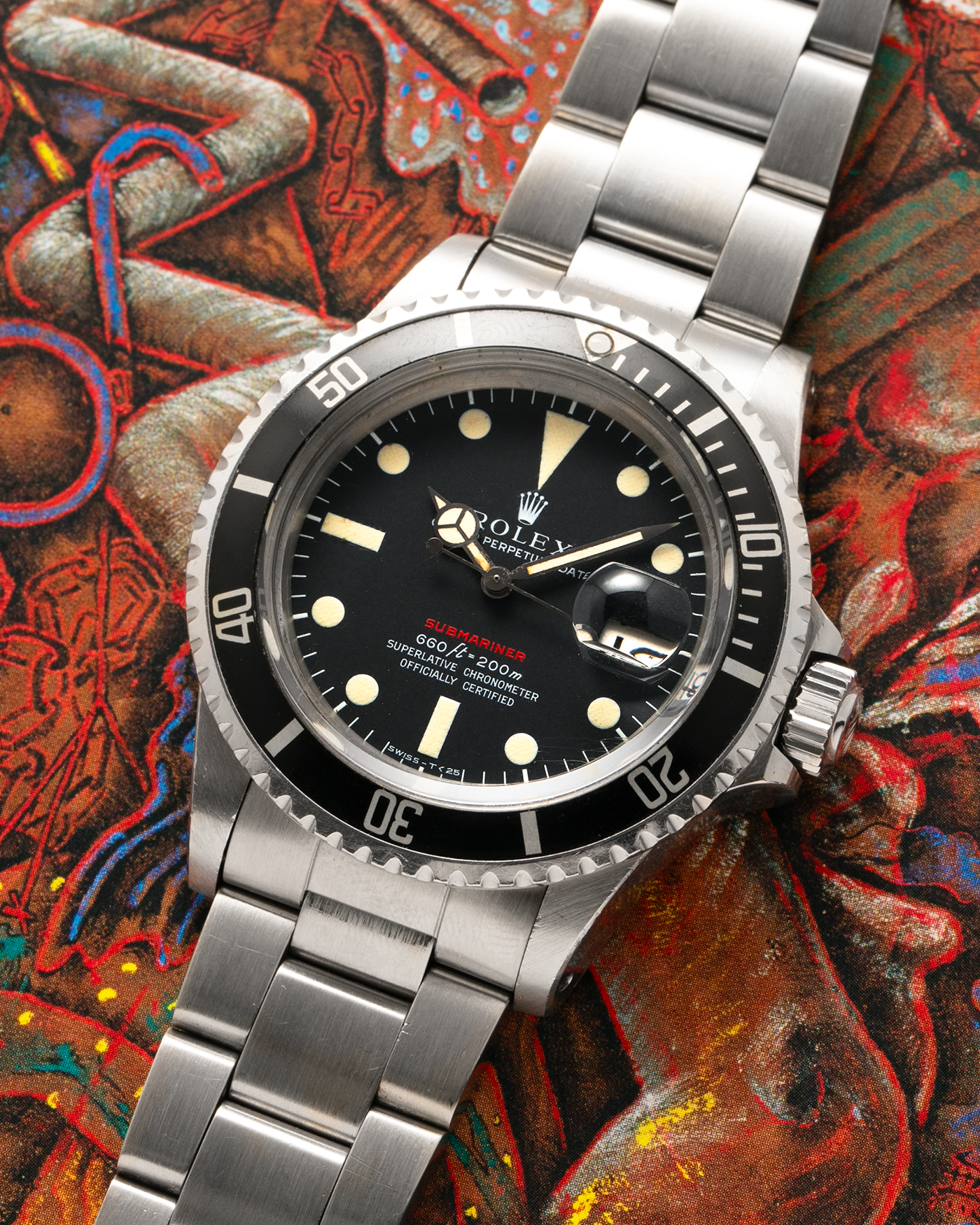 Brand: Rolex
Year: 1976
Model: Submariner
Reference Number: 1680 ‘Red’
Serial Number: 38XXXXX
Material: Stainless Steel
Movement: Rolex Cal. 1575, Self-Winding
Case Dimensions: 40mm
Lug Width: 20mm
Bracelet: Rolex 93150 Oyster Bracelet with Signed Stainless Steel Clasp and XXX End Links