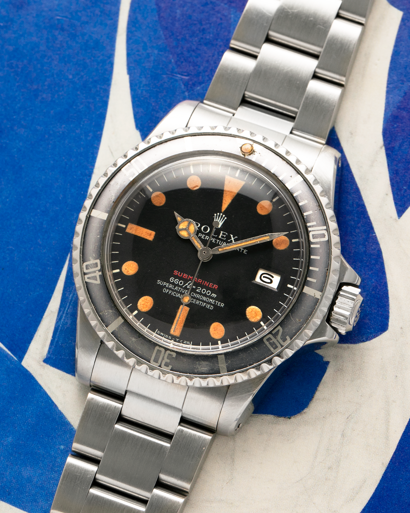 Brand: Rolex
Year: 1972
Model: Submariner
Reference Number: 1680 ‘Red’
Serial Number: 308XXXX
Material: Stainless Steel
Movement: Rolex Cal. 1575, Self-Winding
Case Dimensions: 40mm x 16mm including Domed Crystal (Lug-to-Lug 47.5mm)
Lug Width: 20mm
Bracelet: Rolex 93150 Oyster Bracelet with Signed Stainless Steel Clasp