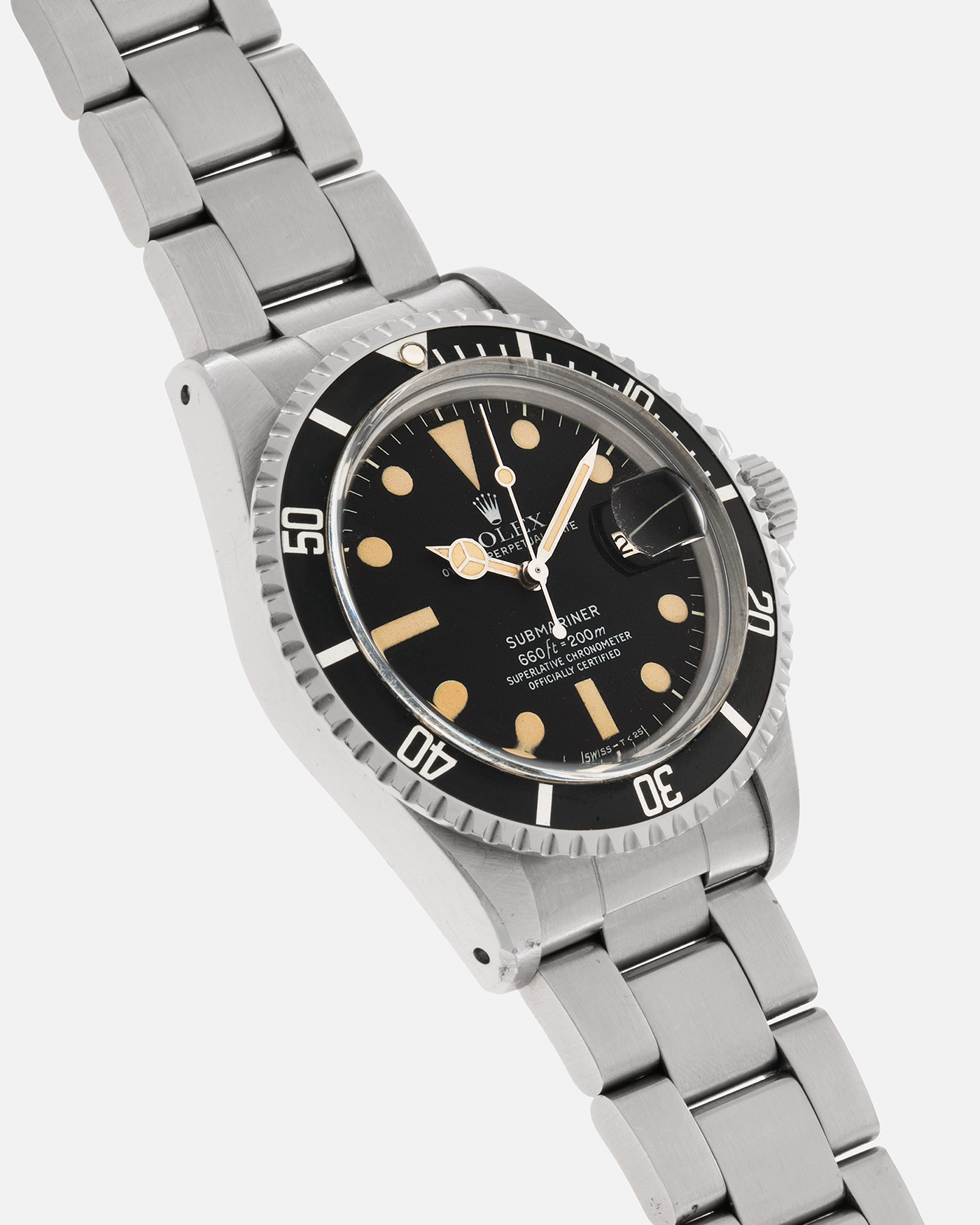 Brand: Rolex Year: 1978 Model: ‘White’ Submariner Reference Number: 1680 Serial Number: 529XXXX Material: Stainless Steel Movement: Rolex Cal. 1575, Self-Winding Case Diameter: 39mm Lug Width: 20mm Bracelet: Rolex Stainless Steel ‘93150’ Oyster bracelet with Signed ‘VB’ Clasp and ‘580’ Curved End Links