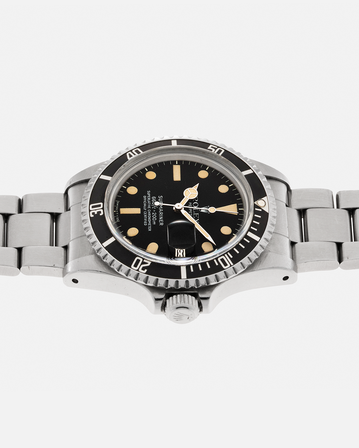 Brand: Rolex Year: 1978 Model: ‘White’ Submariner Reference Number: 1680 Serial Number: 529XXXX Material: Stainless Steel Movement: Rolex Cal. 1575, Self-Winding Case Diameter: 39mm Lug Width: 20mm Bracelet: Rolex Stainless Steel ‘93150’ Oyster bracelet with Signed ‘VB’ Clasp and ‘580’ Curved End Links