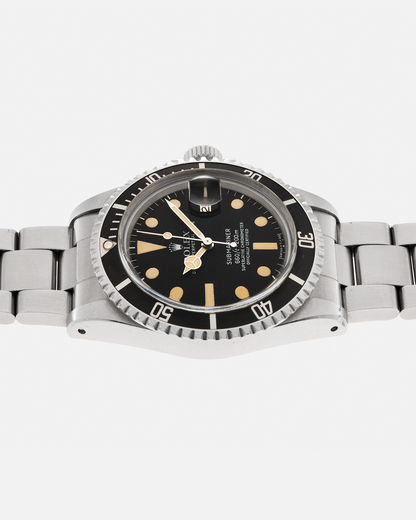 Brand: Rolex Year: 1978 Model: ‘White’ Submariner Reference Number: 1680 Serial Number: 529XXXX Material: Stainless Steel Movement: Rolex Cal. 1575, Self-Winding Case Diameter: 39mm Lug Width: 20mm Bracelet: Rolex Stainless Steel ‘93150’ Oyster bracelet with Signed ‘VB’ Clasp and ‘580’ Curved End Links