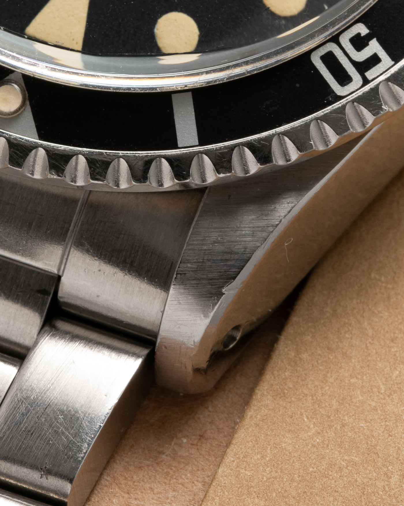 Brand: Rolex Year: 1978 Model: ‘White’ Submariner Reference Number: 1680 Serial Number: 529XXXX Material: Stainless Steel Movement: Rolex Cal. 1575, Self-Winding Case Diameter: 39mm Lug Width: 20mm Bracelet: Rolex Stainless Steel ‘93150’ Oyster bracelet with Signed ‘VB’ Clasp and ‘580’ Curved End Links