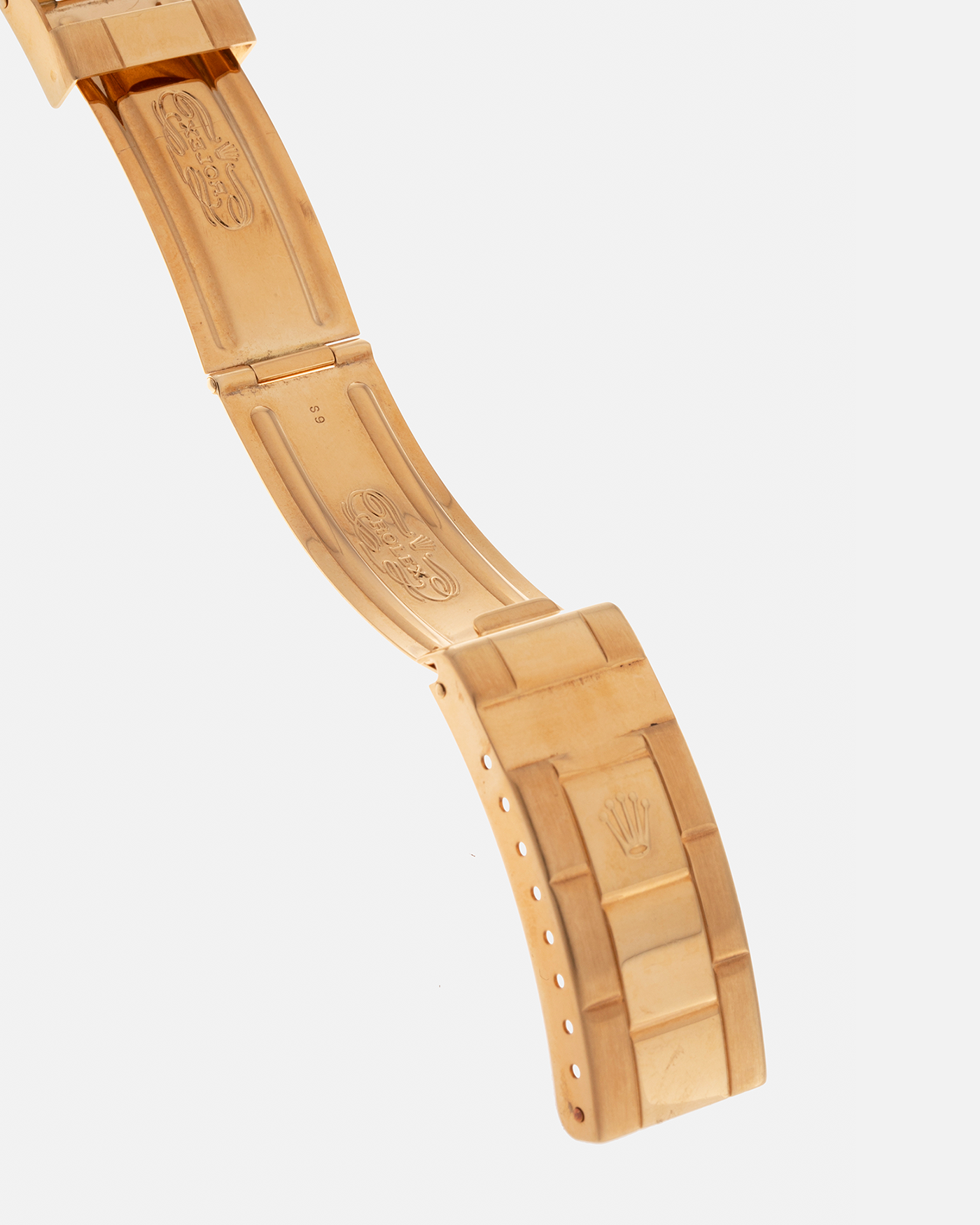 Brand: Rolex
Year: 1984
Model: Submariner
Reference Number: 16808
Serial Number: 838XXXX
Material: 18-carat Yellow Gold
Movement: Rolex Cal. 3035, Self-Winding
Case Dimensions: 40mm x 12.5mm (Lug-to-Lug 47.5mm)
Lug Width: 20mm
Bracelet: Rolex 92908 Oyster Bracelet in 18-carat Yellow Gold With Signed Deployant Clasp with Dive Extension