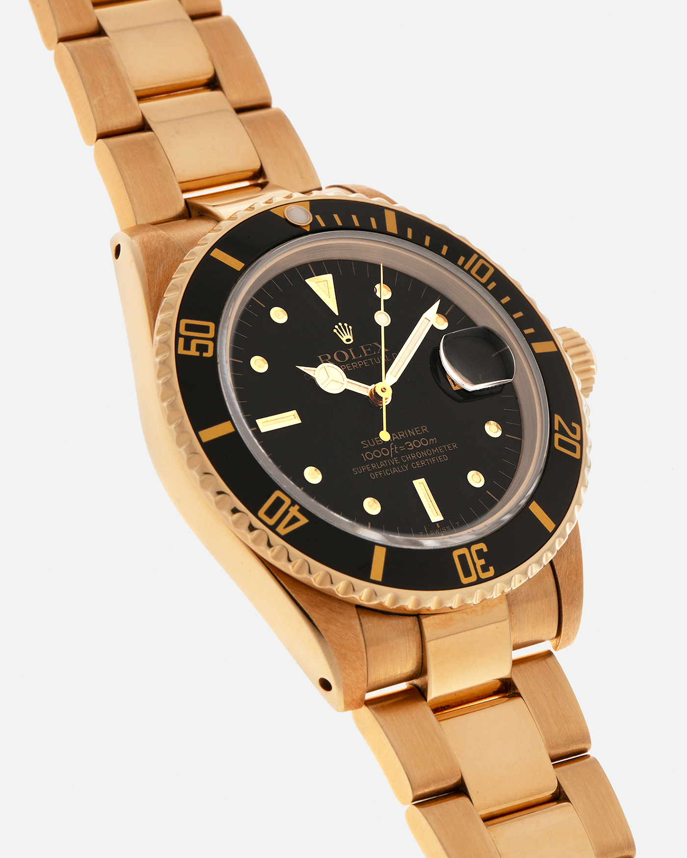 Brand: Rolex
Year: 1984
Model: Submariner
Reference Number: 16808
Serial Number: 838XXXX
Material: 18-carat Yellow Gold
Movement: Rolex Cal. 3035, Self-Winding
Case Dimensions: 40mm x 12.5mm (Lug-to-Lug 47.5mm)
Lug Width: 20mm
Bracelet: Rolex 92908 Oyster Bracelet in 18-carat Yellow Gold With Signed Deployant Clasp with Dive Extension