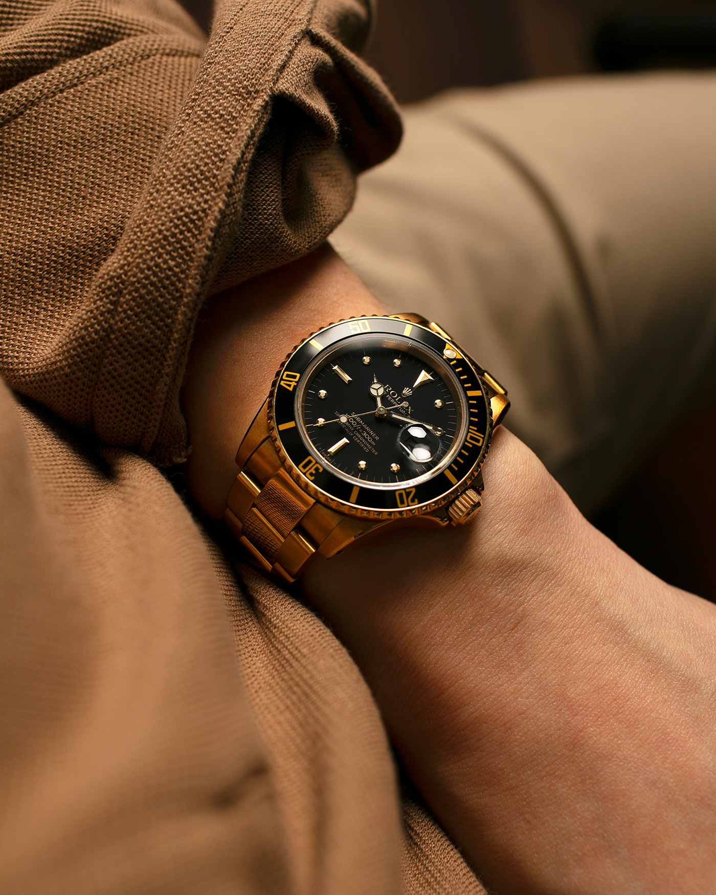 Brand: Rolex
Year: 1984
Model: Submariner
Reference Number: 16808
Serial Number: 838XXXX
Material: 18-carat Yellow Gold
Movement: Rolex Cal. 3035, Self-Winding
Case Dimensions: 40mm x 12.5mm (Lug-to-Lug 47.5mm)
Lug Width: 20mm
Bracelet: Rolex 92908 Oyster Bracelet in 18-carat Yellow Gold With Signed Deployant Clasp with Dive Extension