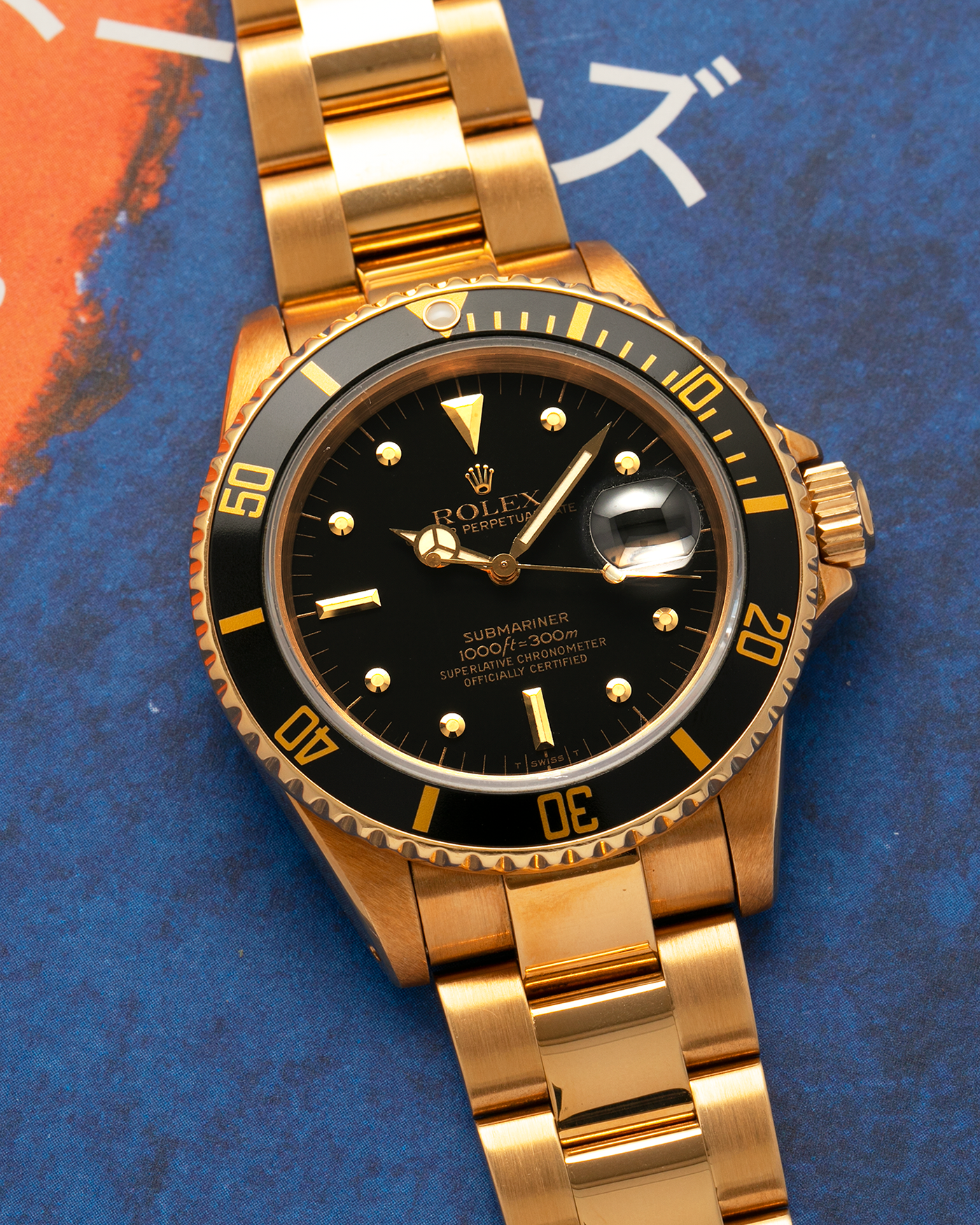 Brand: Rolex
Year: 1984
Model: Submariner
Reference Number: 16808
Serial Number: 838XXXX
Material: 18-carat Yellow Gold
Movement: Rolex Cal. 3035, Self-Winding
Case Dimensions: 40mm x 12.5mm (Lug-to-Lug 47.5mm)
Lug Width: 20mm
Bracelet: Rolex 92908 Oyster Bracelet in 18-carat Yellow Gold With Signed Deployant Clasp with Dive Extension