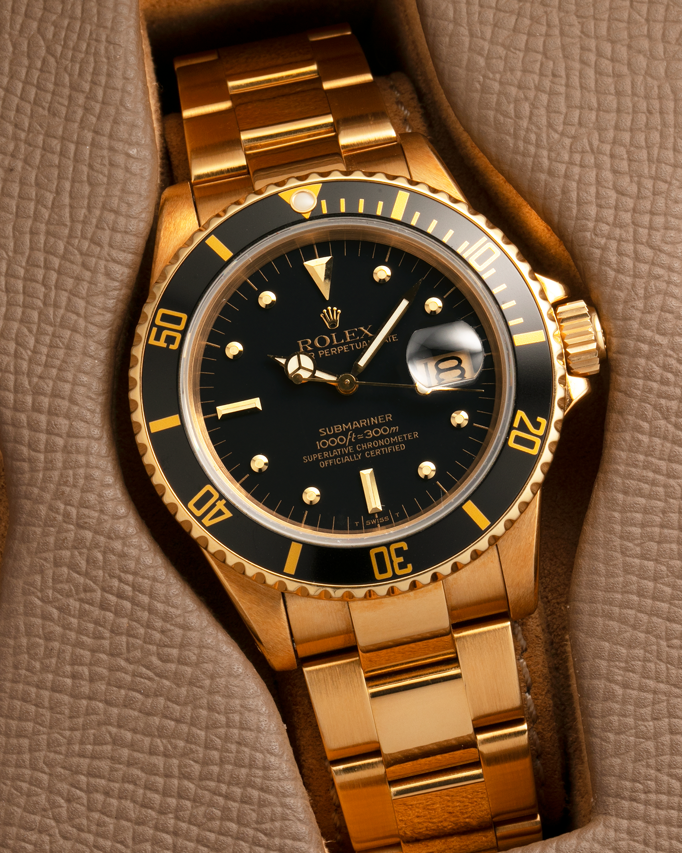 Brand: Rolex
Year: 1984
Model: Submariner
Reference Number: 16808
Serial Number: 838XXXX
Material: 18-carat Yellow Gold
Movement: Rolex Cal. 3035, Self-Winding
Case Dimensions: 40mm x 12.5mm (Lug-to-Lug 47.5mm)
Lug Width: 20mm
Bracelet: Rolex 92908 Oyster Bracelet in 18-carat Yellow Gold With Signed Deployant Clasp with Dive Extension